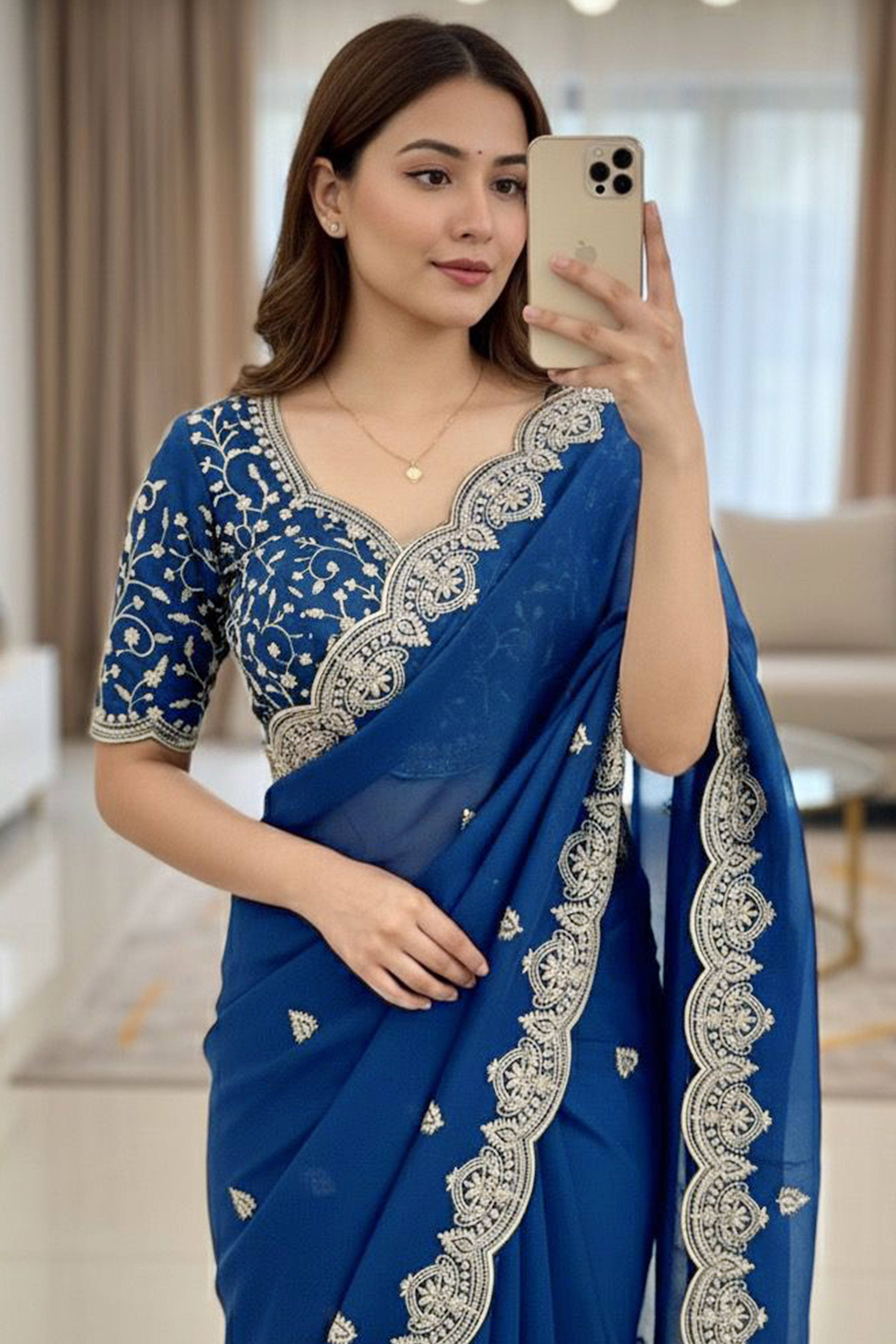 Gorgeous Blue Floral Embroidered Georgette Saree Accented With Luxurious Zari Work