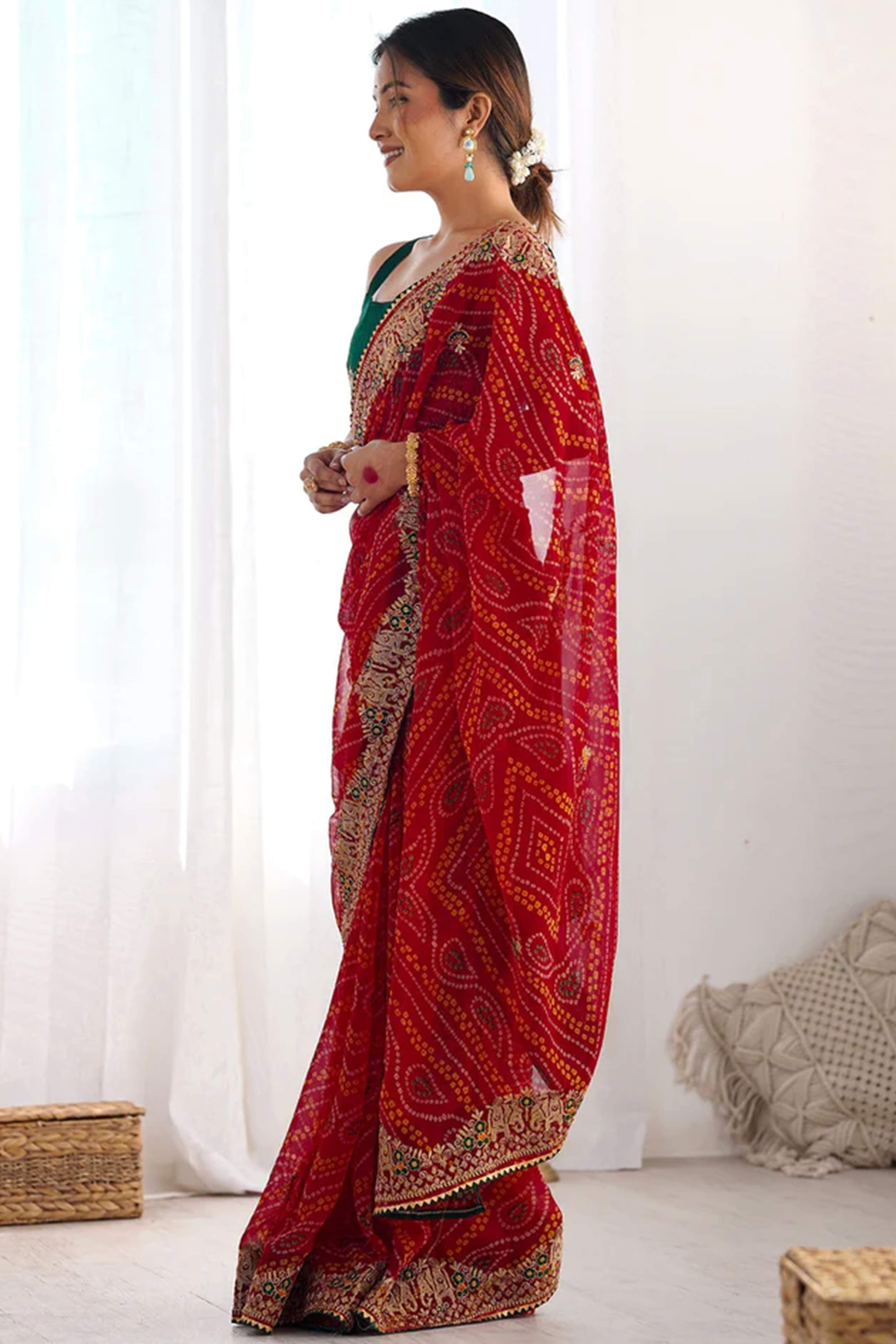 Classic Red Bandhani Print Georgette Saree Enhanced With Intricate Zari Embroidered Border Detailing