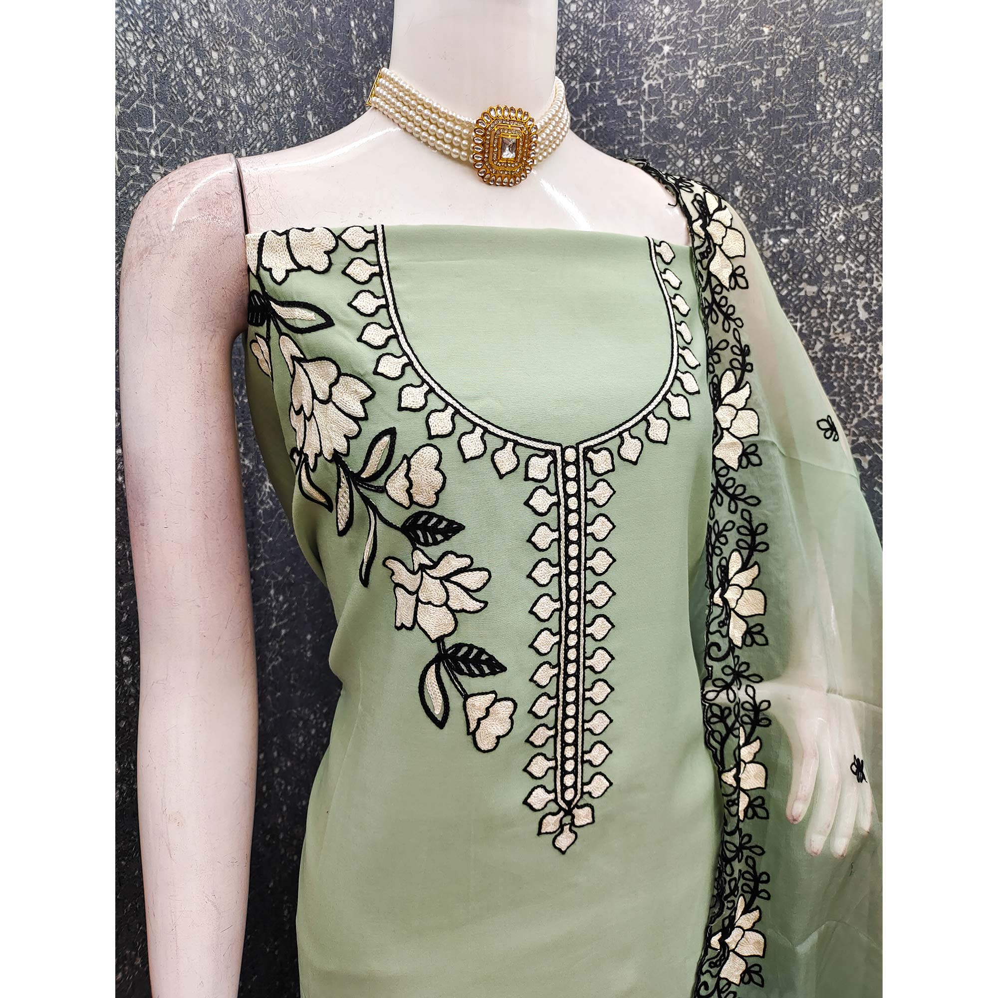 Graceful Green Floral Viscose Dress Material Enhanced With Intricate Thread Embroidery Work