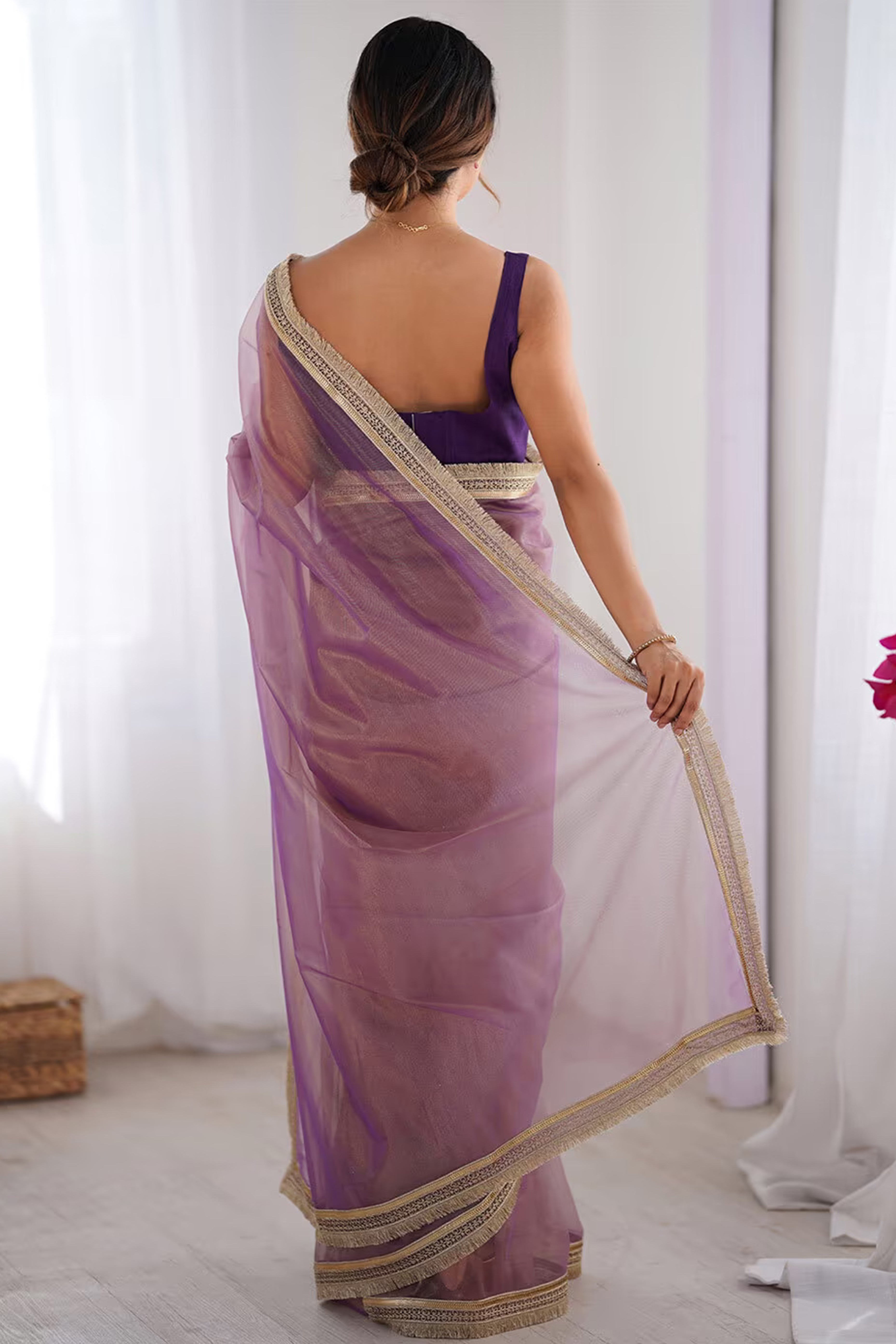 Purple Solid Pattern Net Saree with Refined Lace Work for Parties