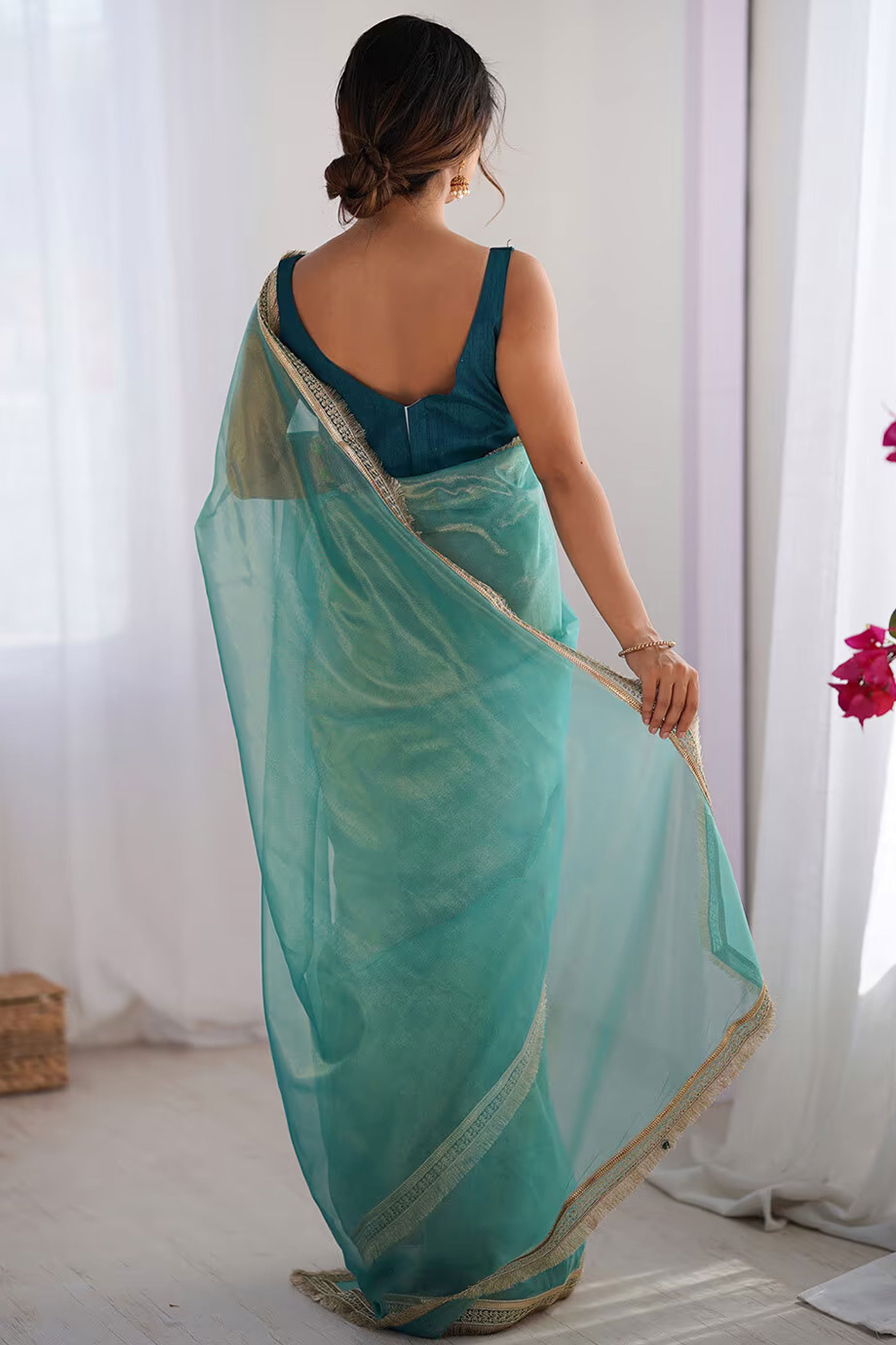 Turquoise Solid Pattern Net Saree with Refined Lace Work for Parties