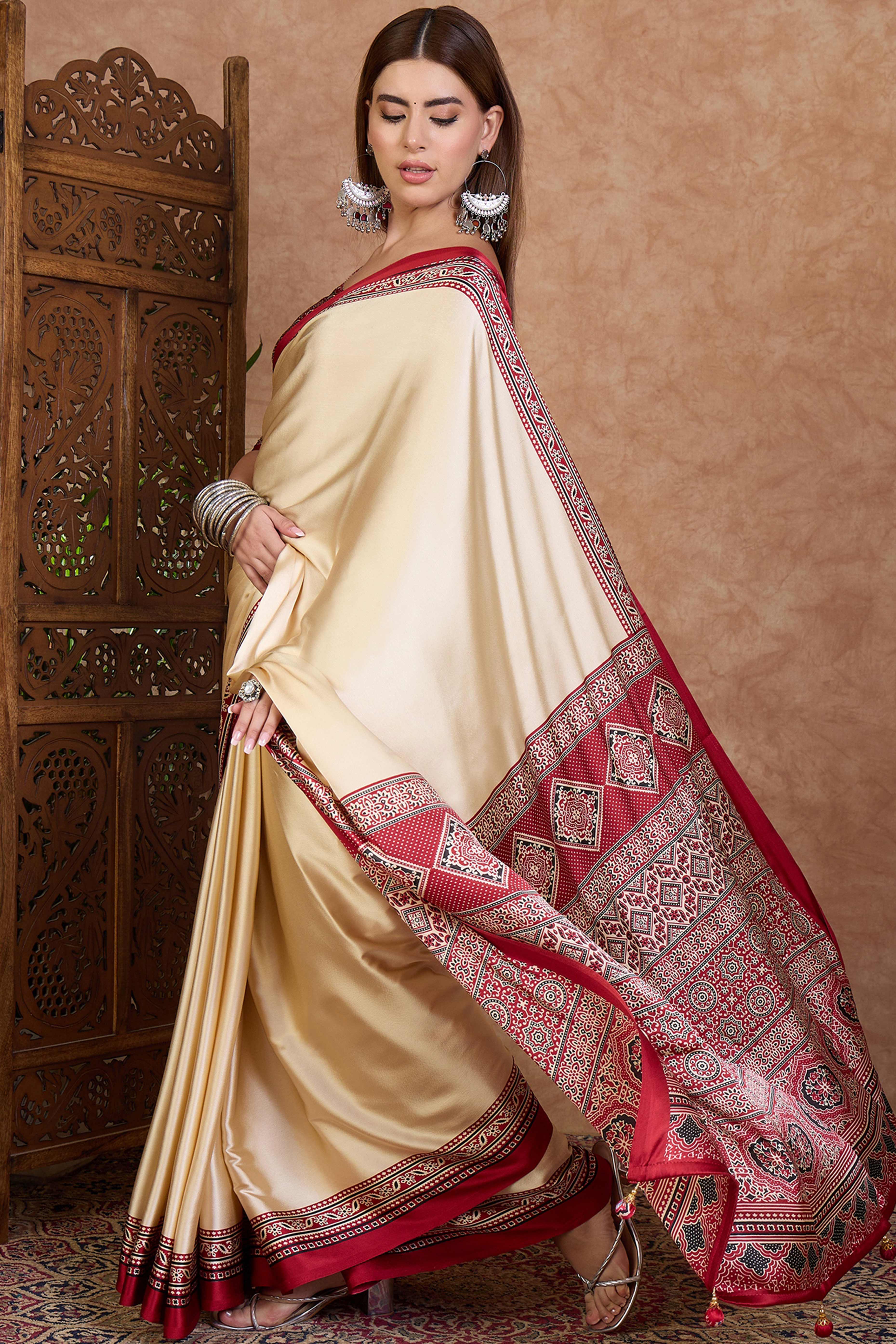 Cream & Red Modal Satin Saree Featuring a Solid Base and Artisanal Ajrakh Pallu