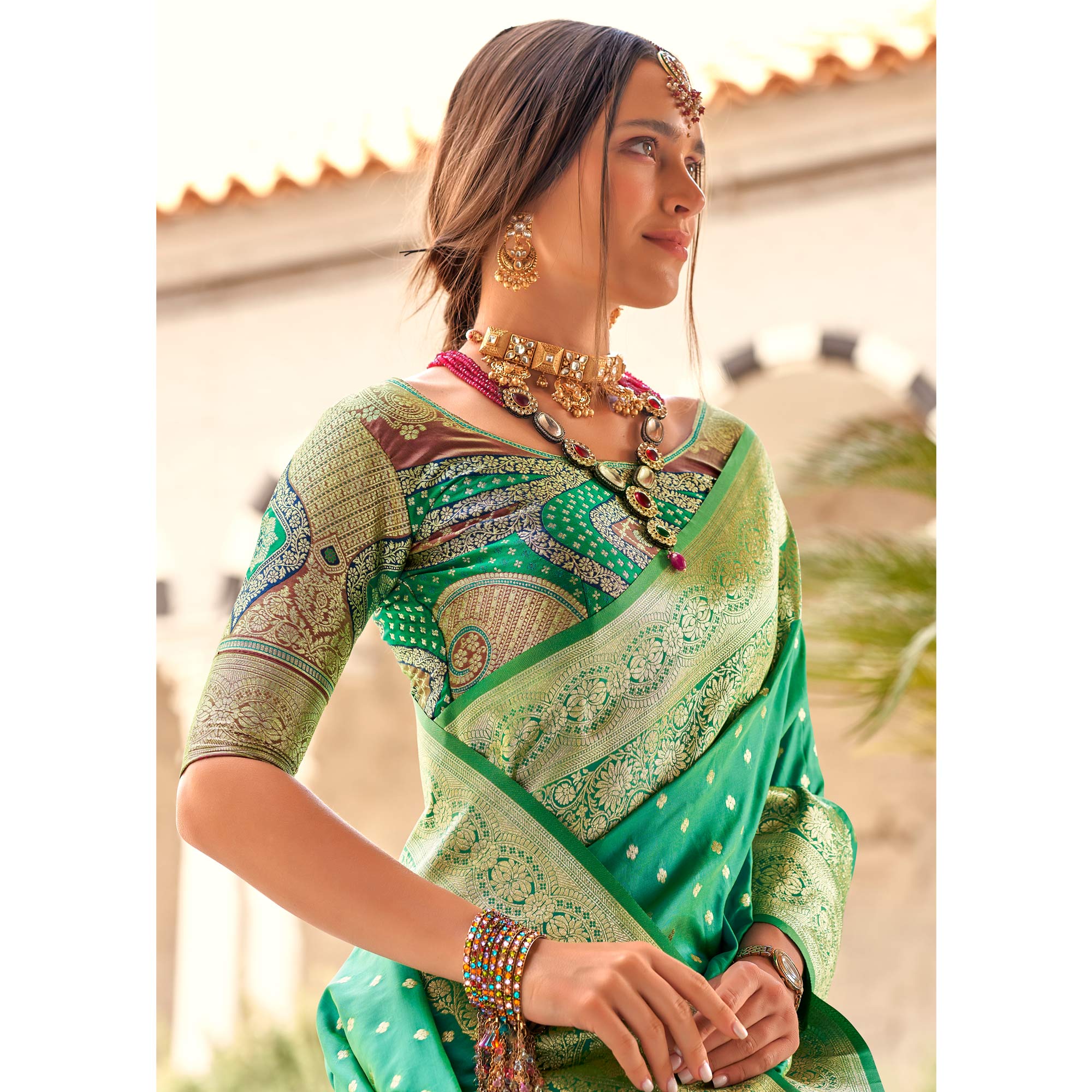 Rama Green Floral Woven Banarasi Silk Saree With Tassels