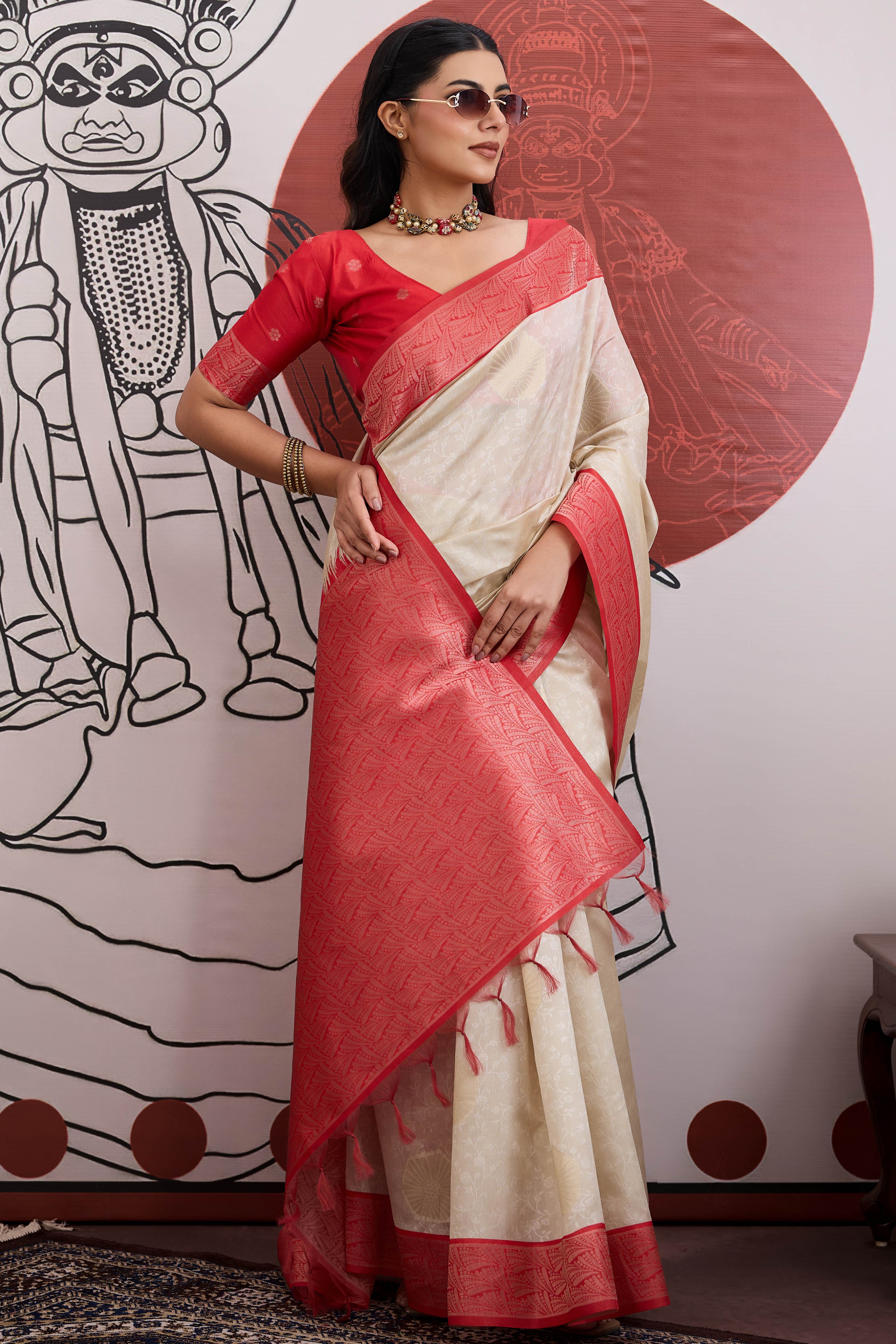 Graceful Cream & Red Zari Weaving Silk Saree Highlighted By Decorative Tassel Pallu