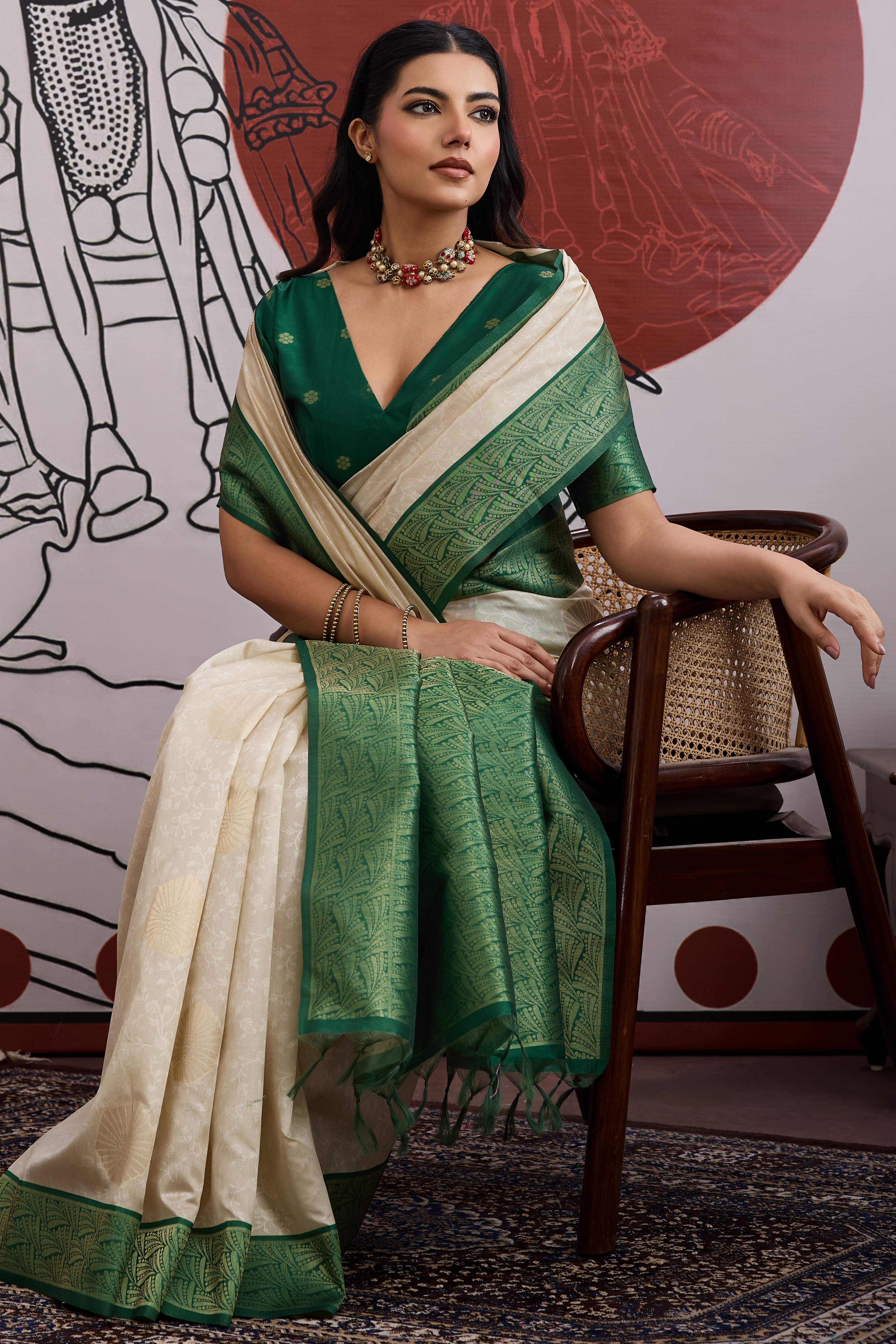 Graceful Cream & Green Zari Weaving Silk Saree Highlighted By Decorative Tassel Pallu