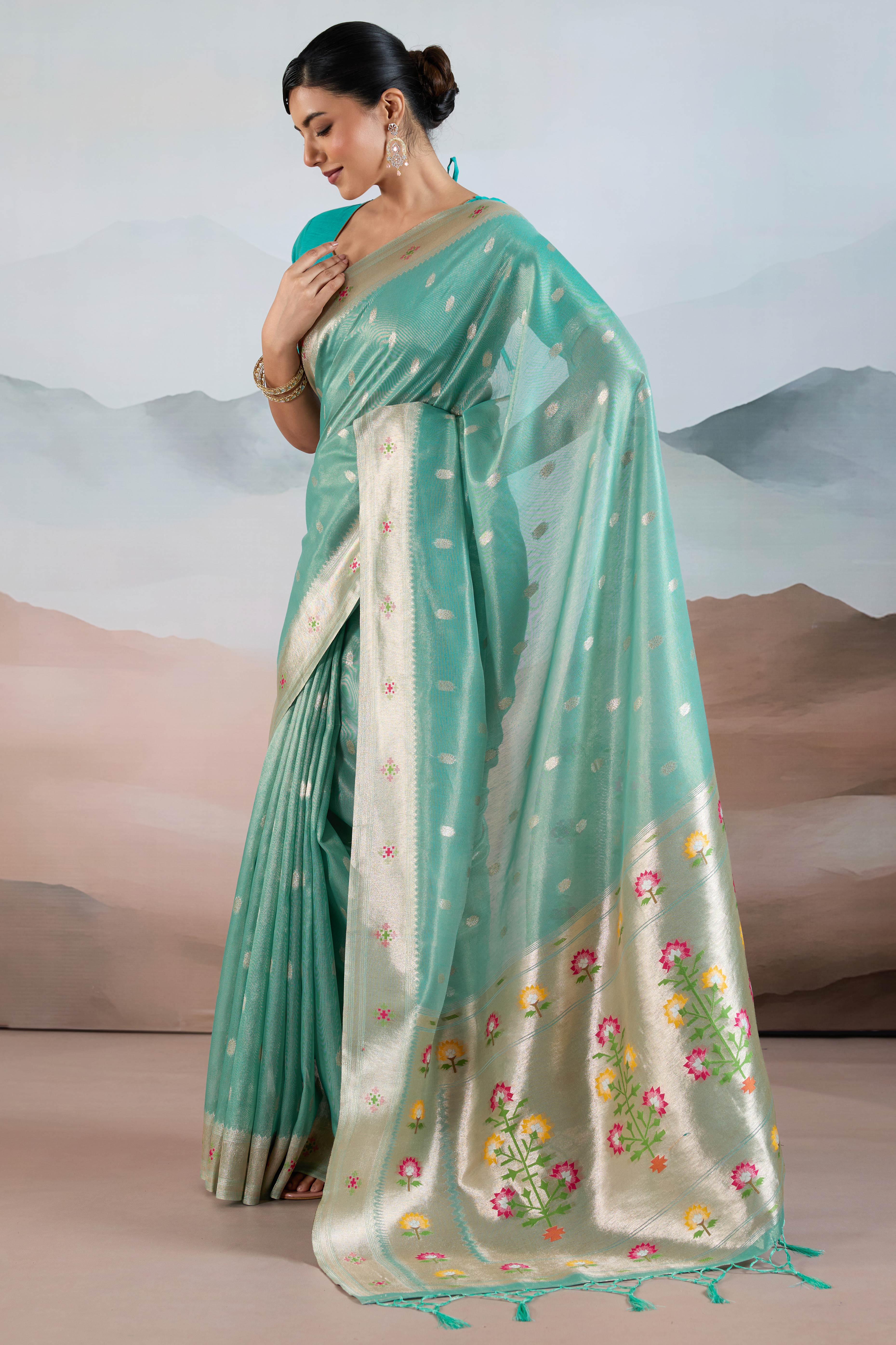 Turquoise Festive Tissue Saree Crafted with Artistic Zari Butti Weaving and a Featherlight Texture