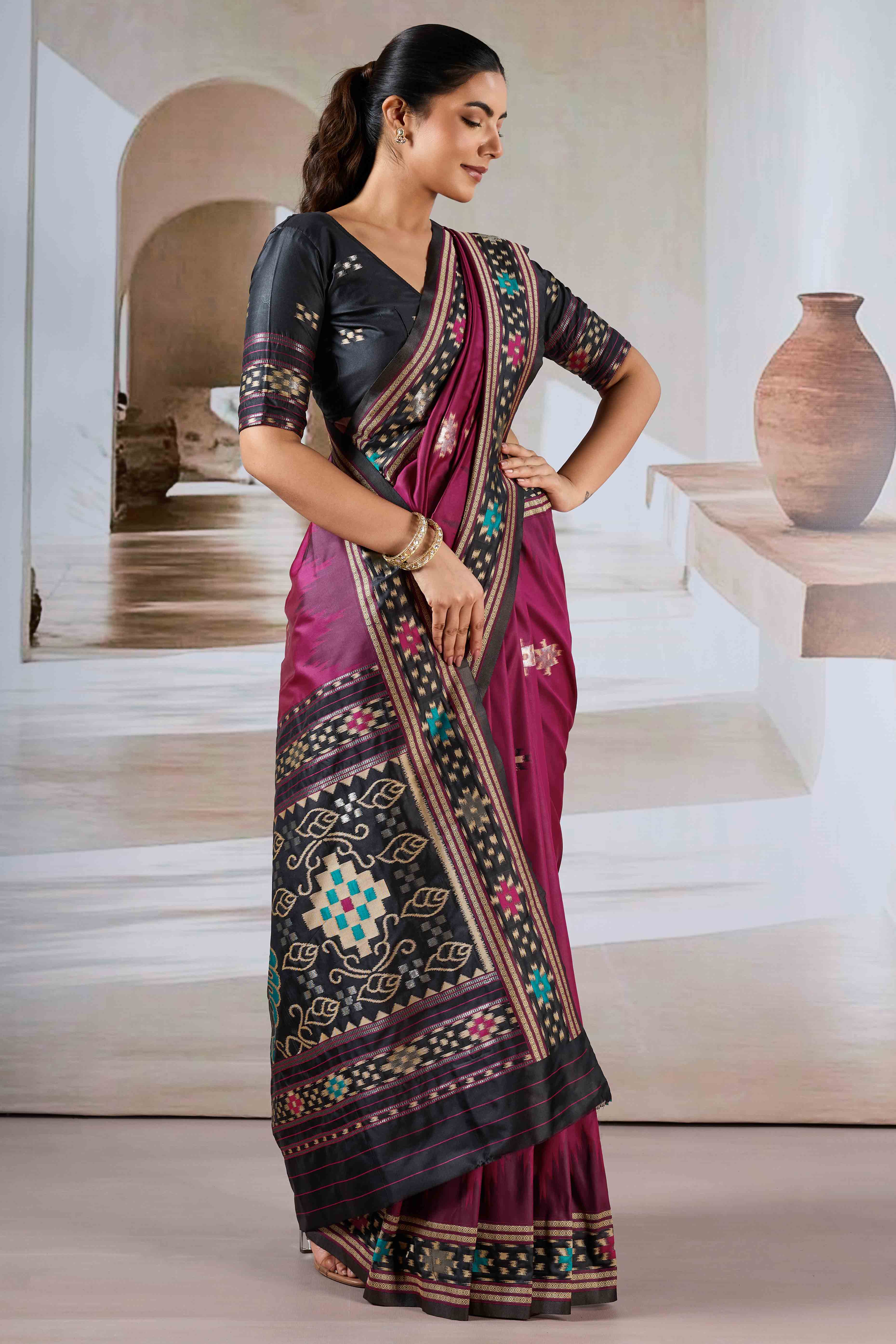 Magenta Art Silk Saree Adorned with Intricate Patola Style Woven Designs
