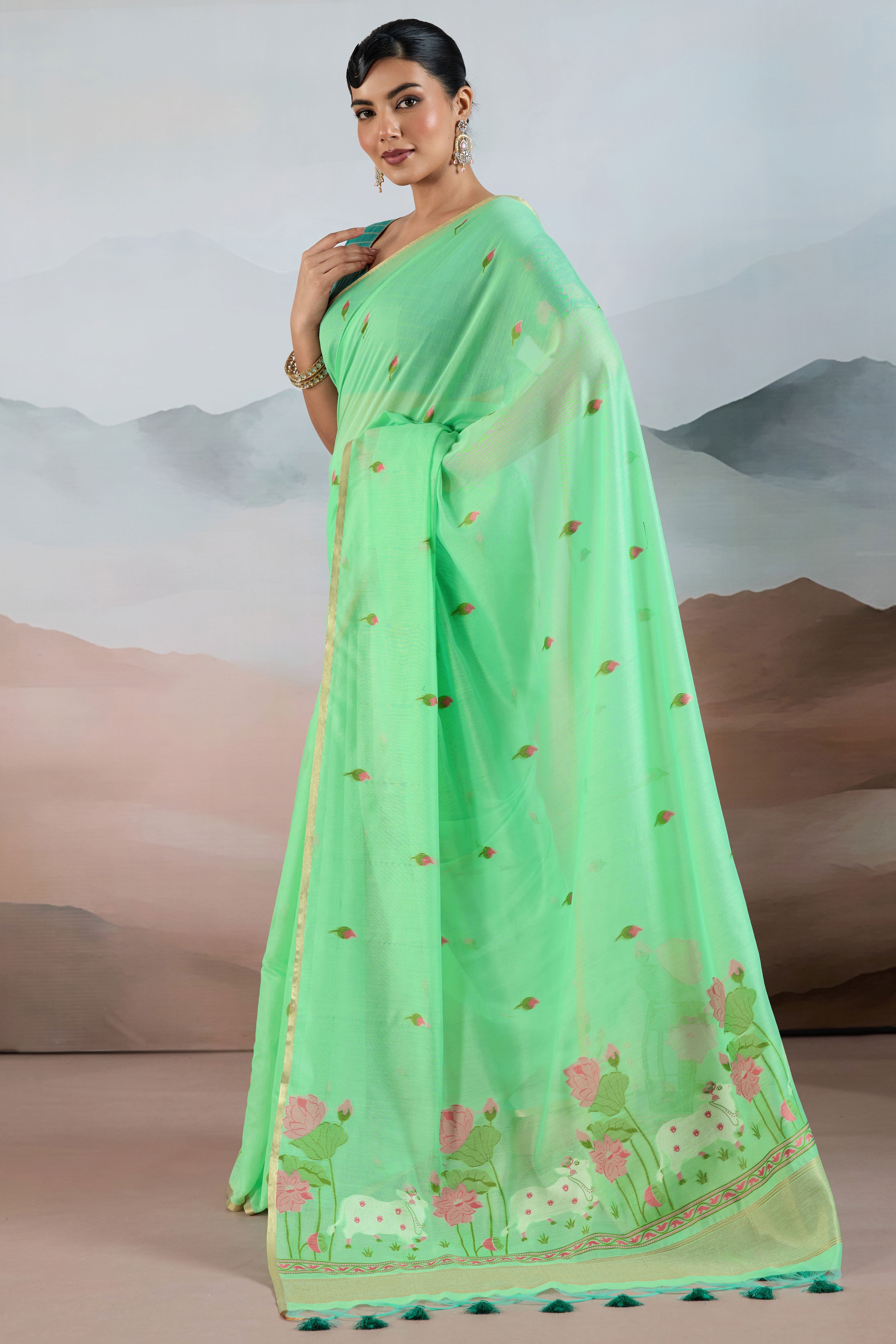 Trendy Sea Green Cotton Blend Weaving Saree Showcasing Floral & Animal Motif & Classic Tassel Pallu
