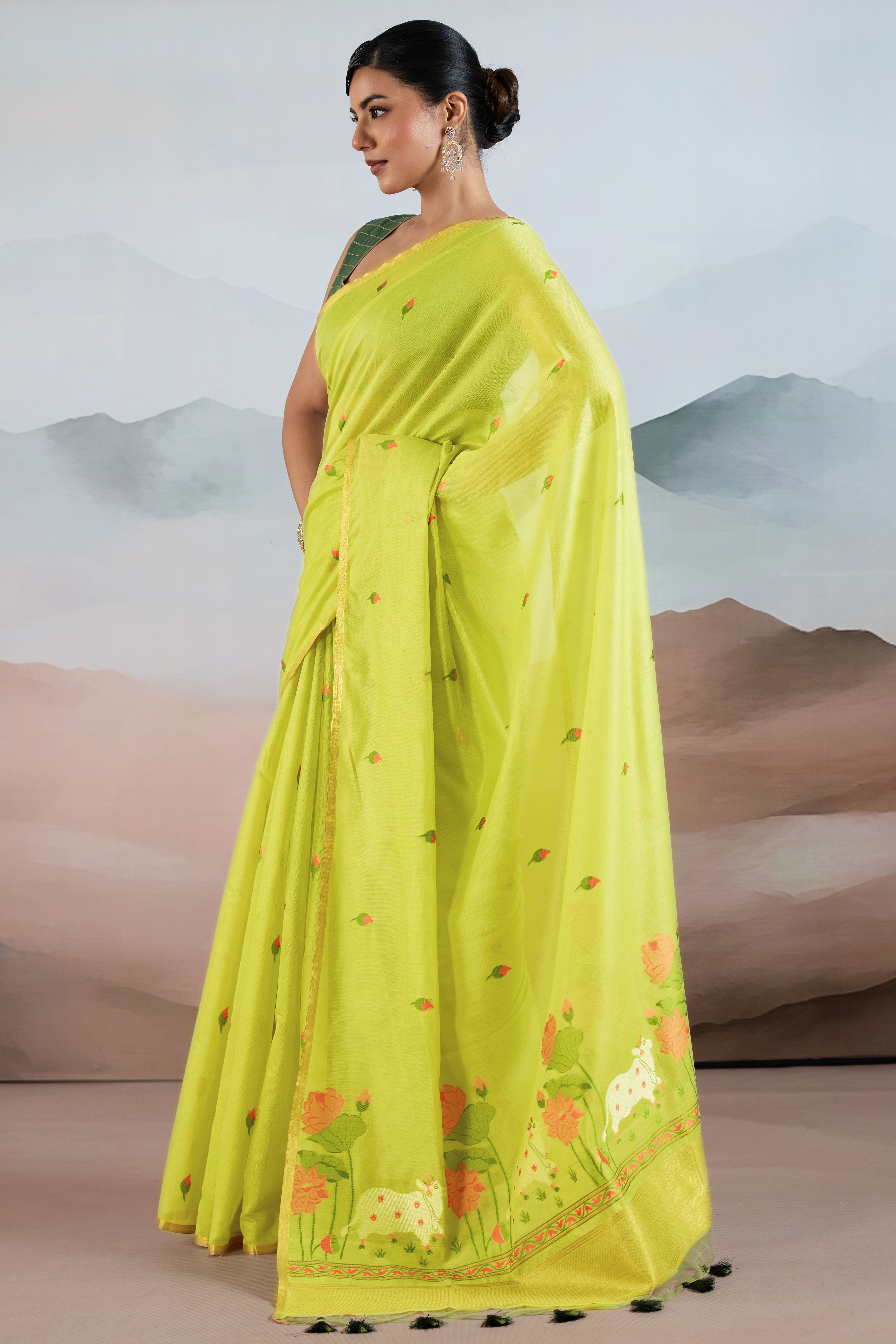 Trendy Green Cotton Blend Weaving Saree Showcasing Floral & Animal Motif & Classic Tassel Pallu