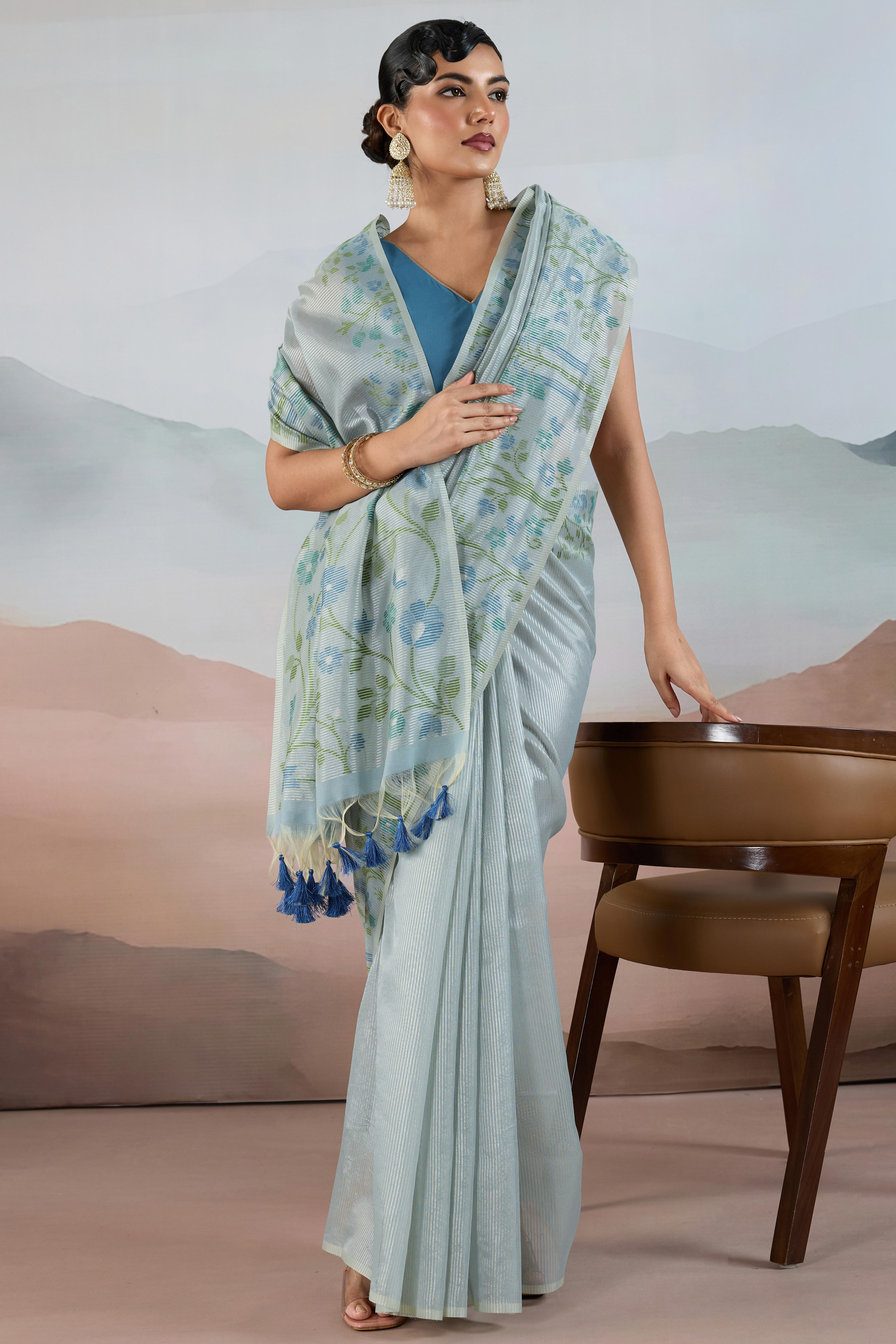 Blue Tissue Silk Saree Showcasing Floral & Striped Weaving With Tassel Adornment