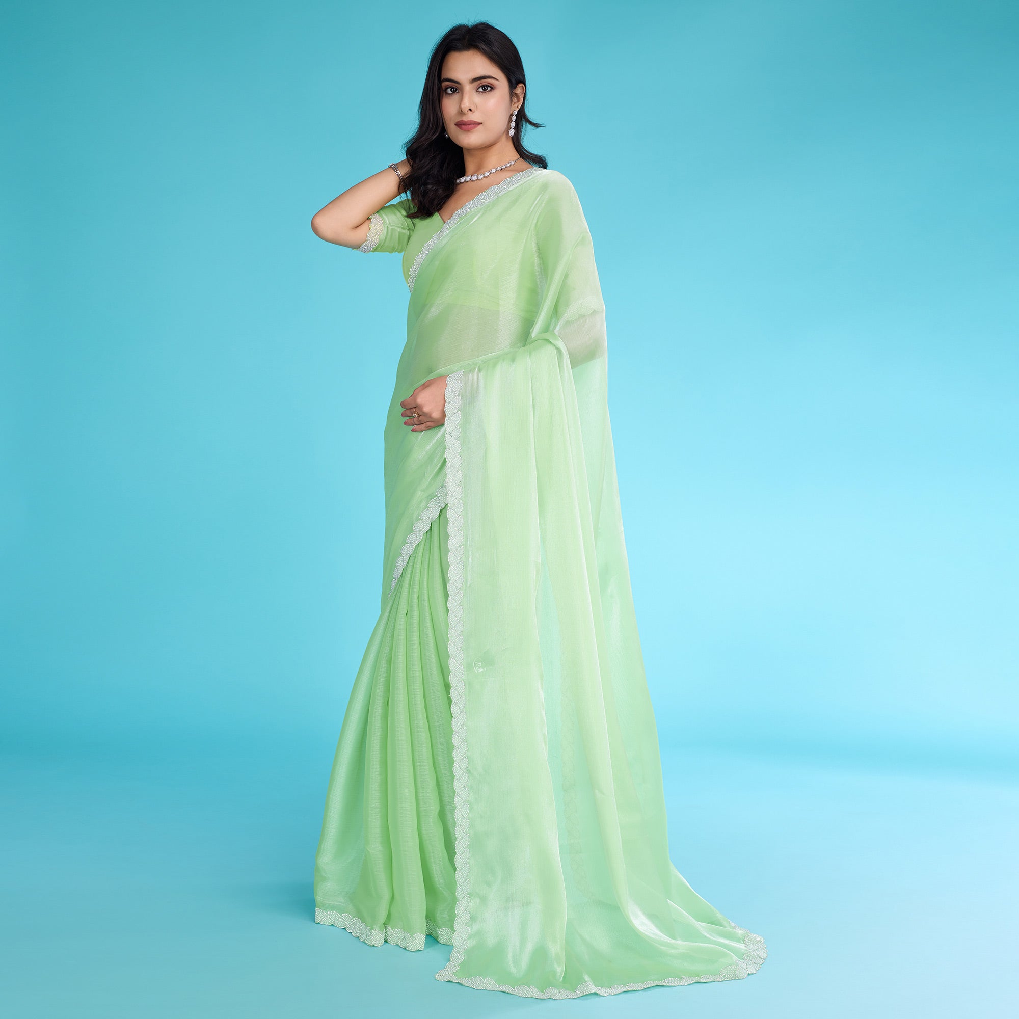 Green Solid With Zarkan & Ceramic Pearl Diamond Lace Tissue Saree