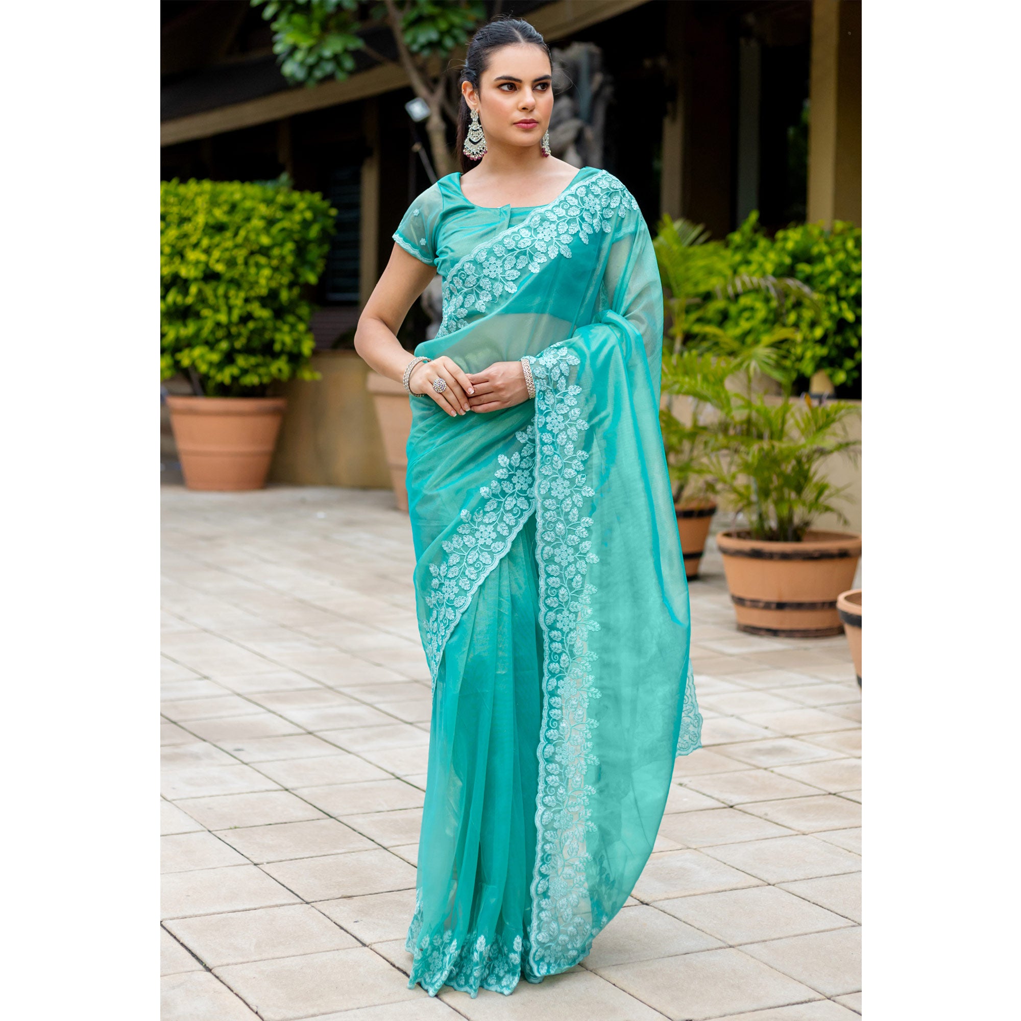 Turquoise Floral Sequins Embroidered Twill Net Saree