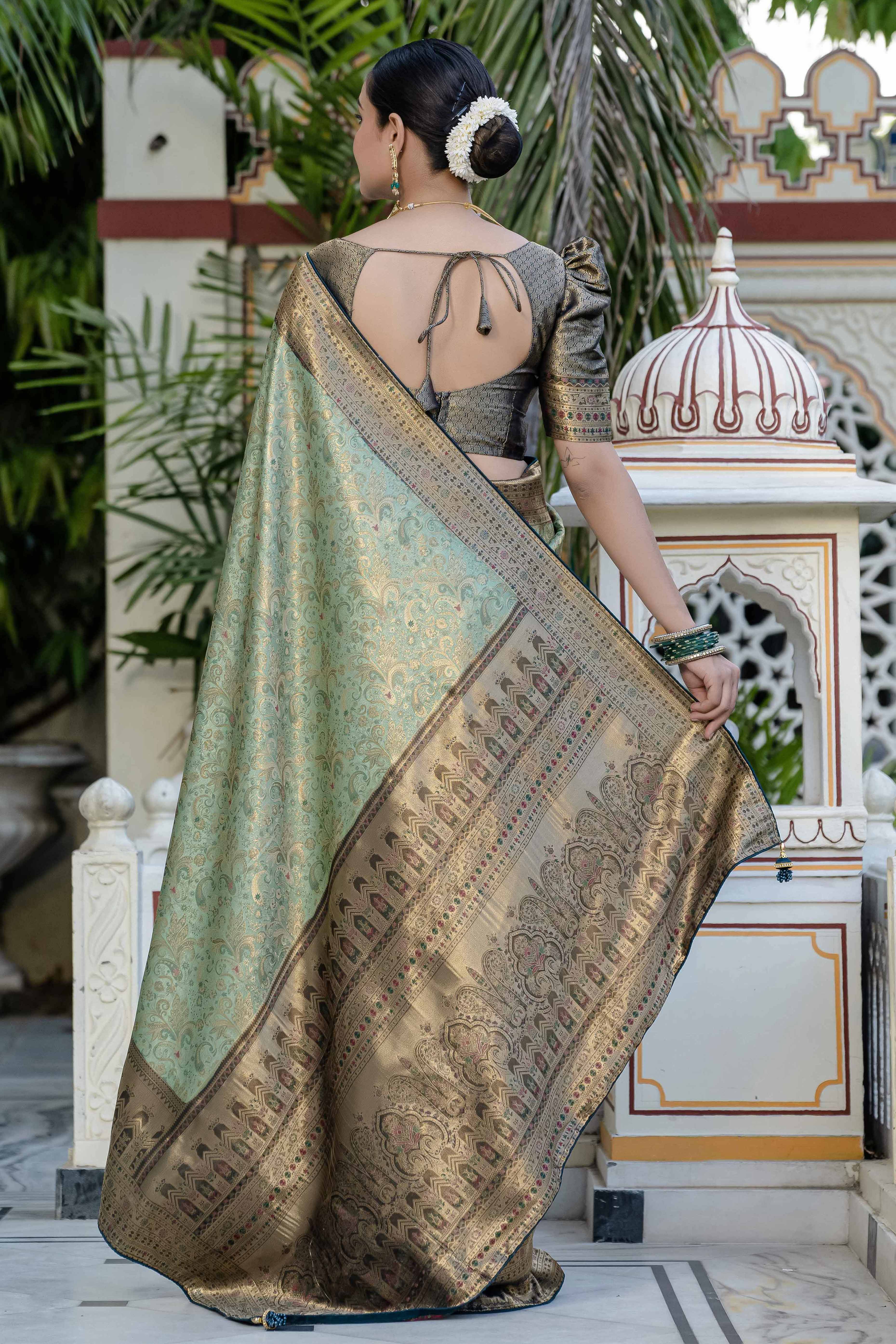 Green Kanjivaram Silk Saree Showcasing Floral Meenakari Zari Weaving With Elegant Piping & Tassels