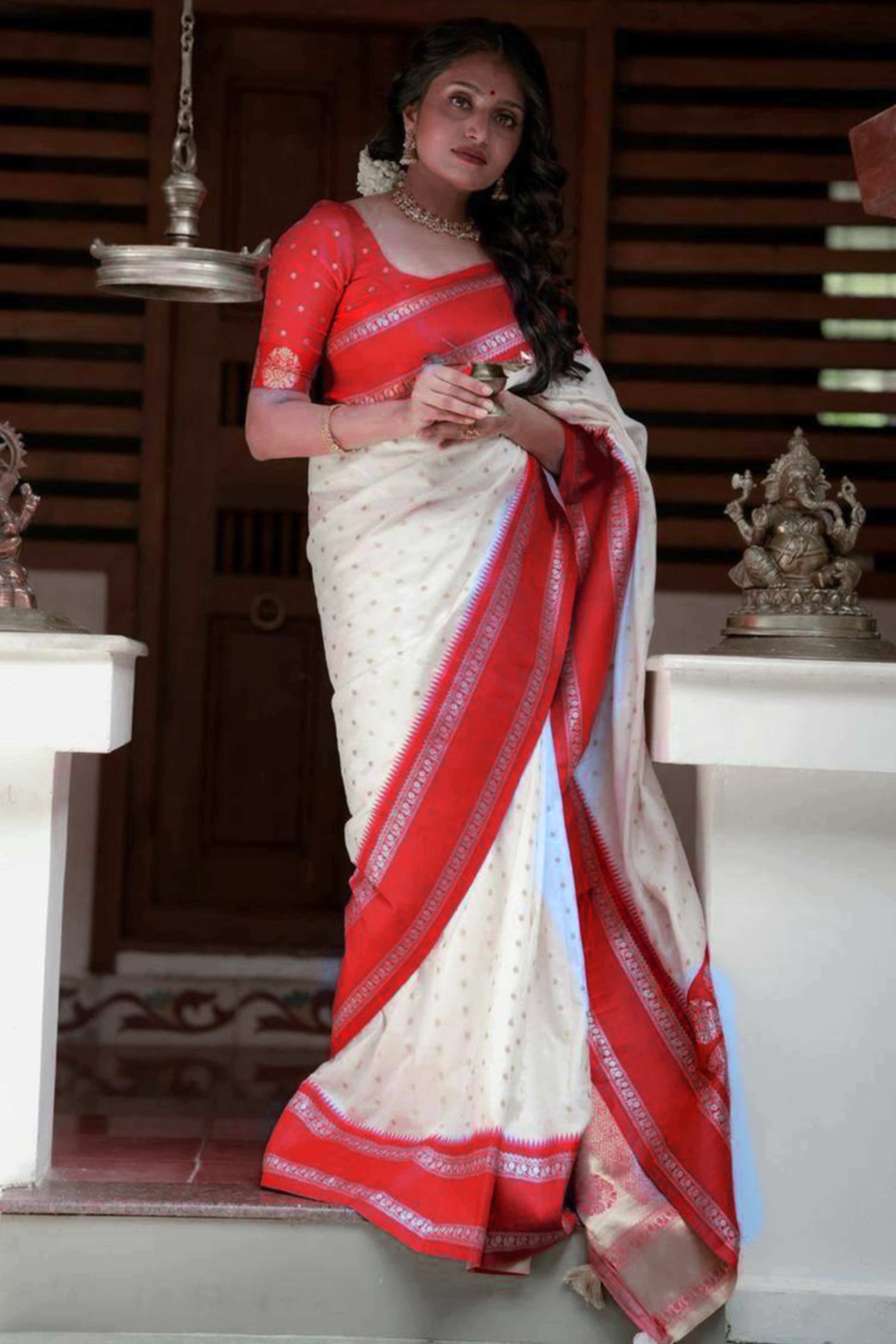 Graceful White & Red Zari Woven Lichi Banarasi Silk Saree With Tassel Accents