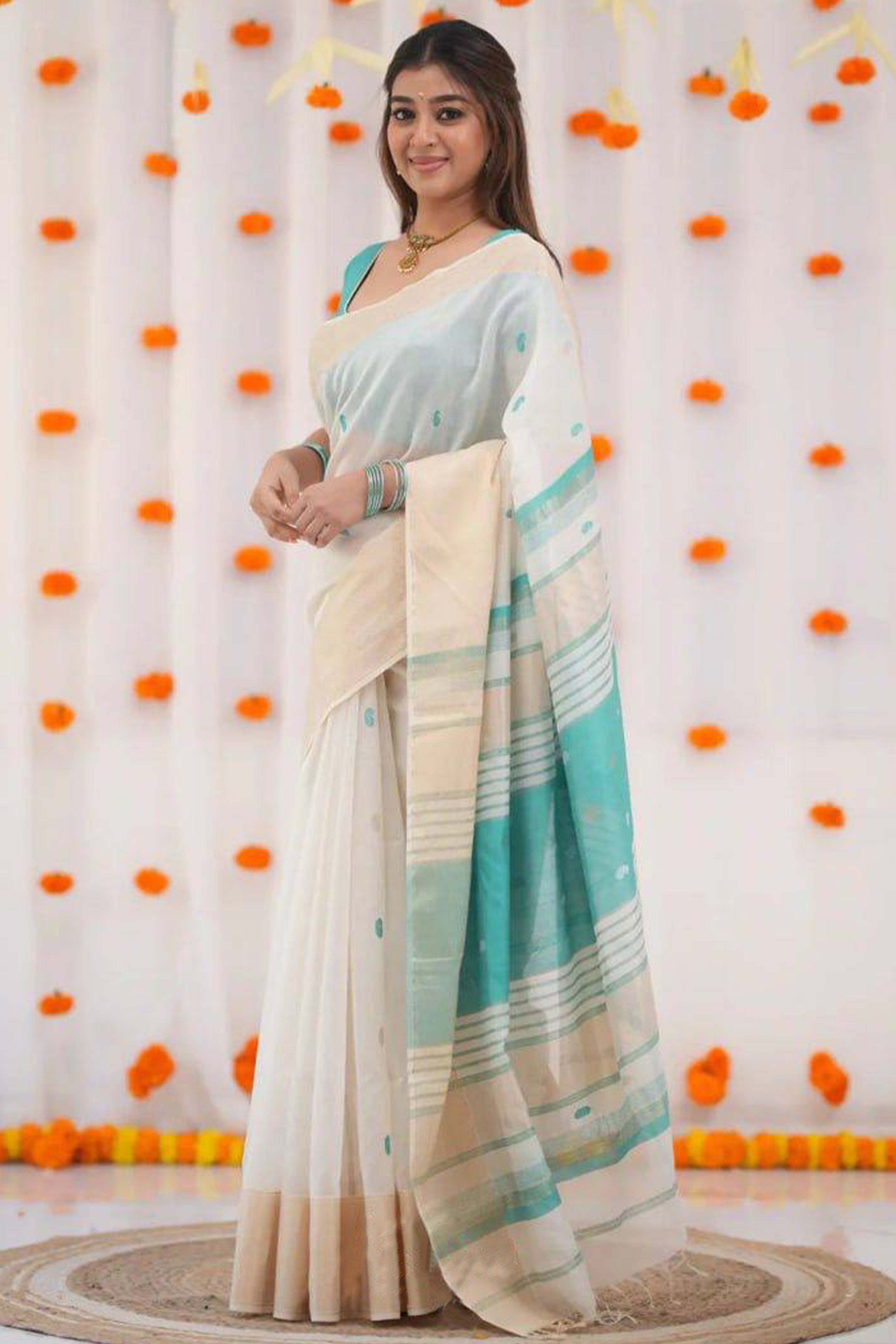 White and Turquoise Zari-Woven Linen Cotton Saree Offering a Refined Festive Look