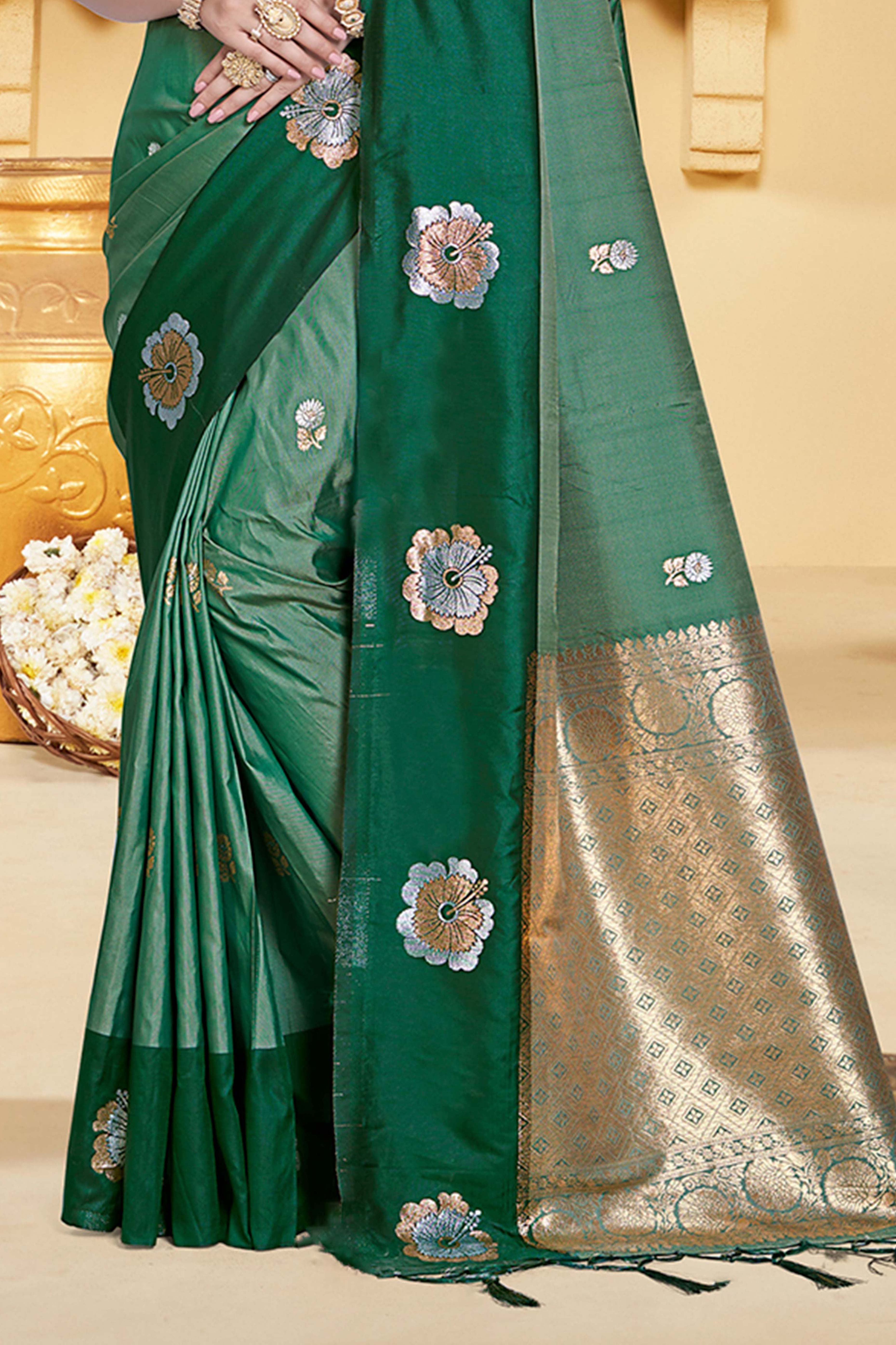 Charming Green Floral Zari Weaving Silk Blend Saree Enhanced With Stylish Tassel Pallu
