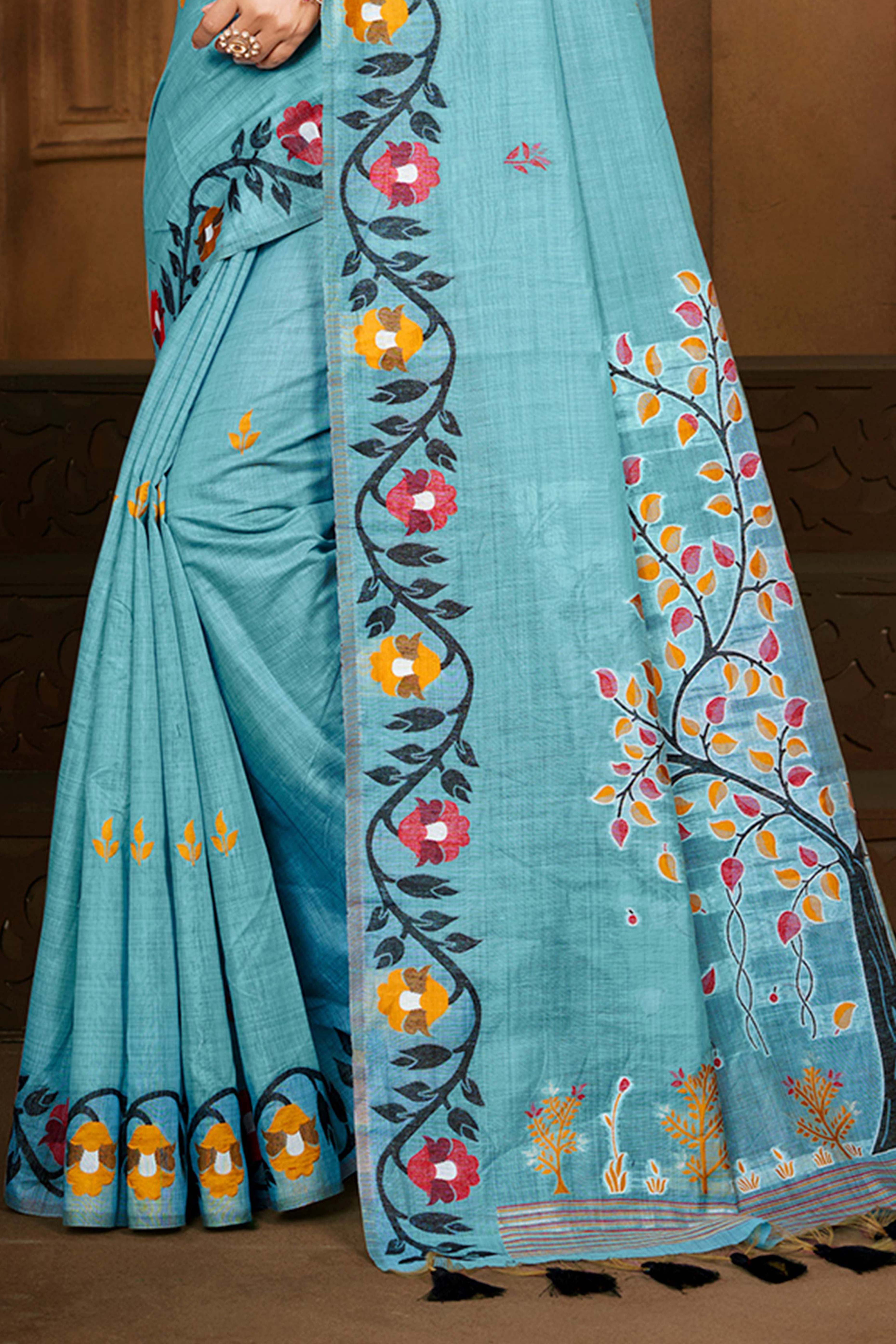 Charming Blue Floral Weaving Cotton Silk Saree Enhanced With Tree Motif Pallu With Tassel