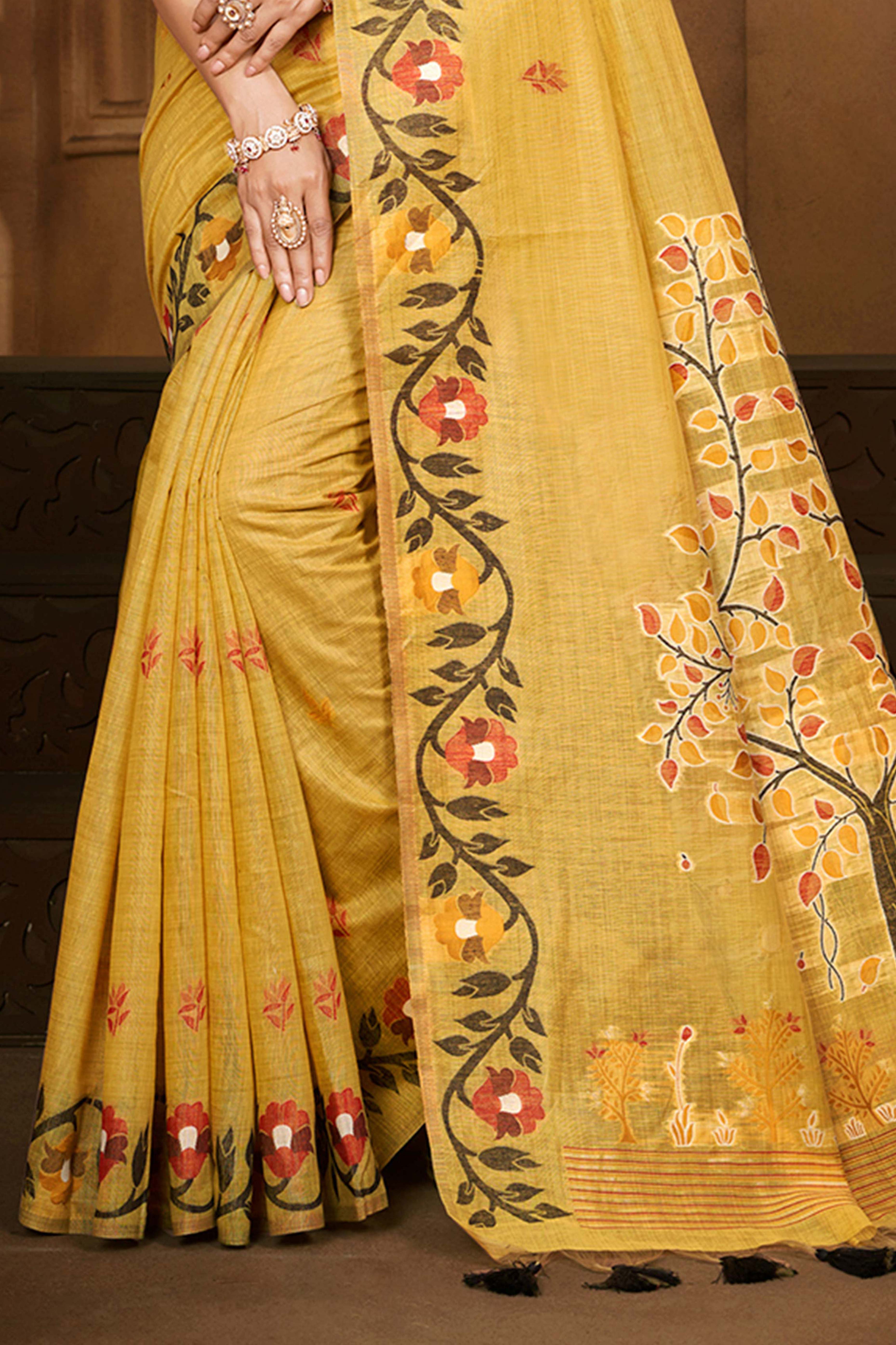 Charming Mustard Floral Weaving Cotton Silk Saree Enhanced With Tree Motif Pallu With Tassel