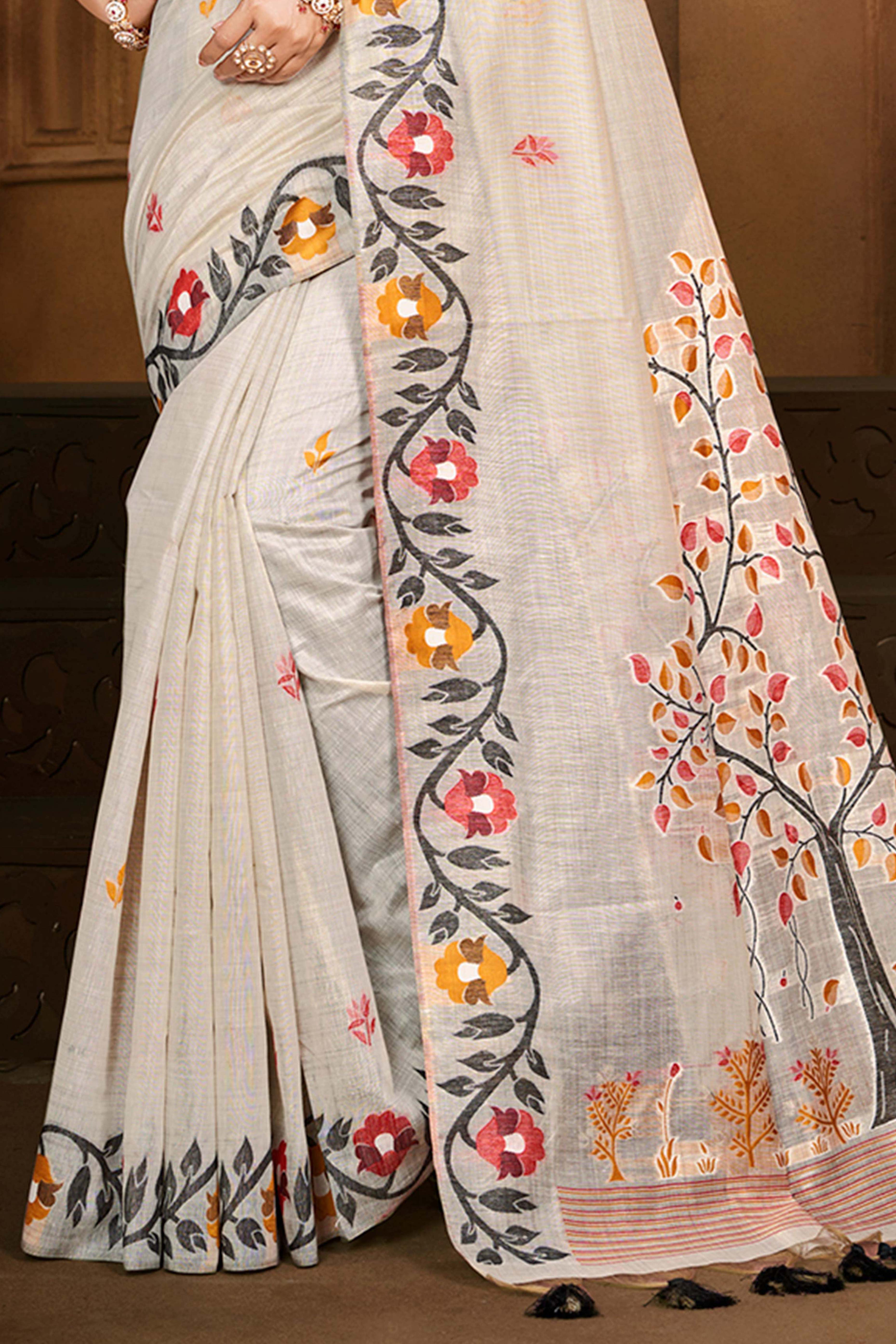 Charming Beige Floral Weaving Cotton Silk Saree Enhanced With Tree Motif Pallu With Tassel
