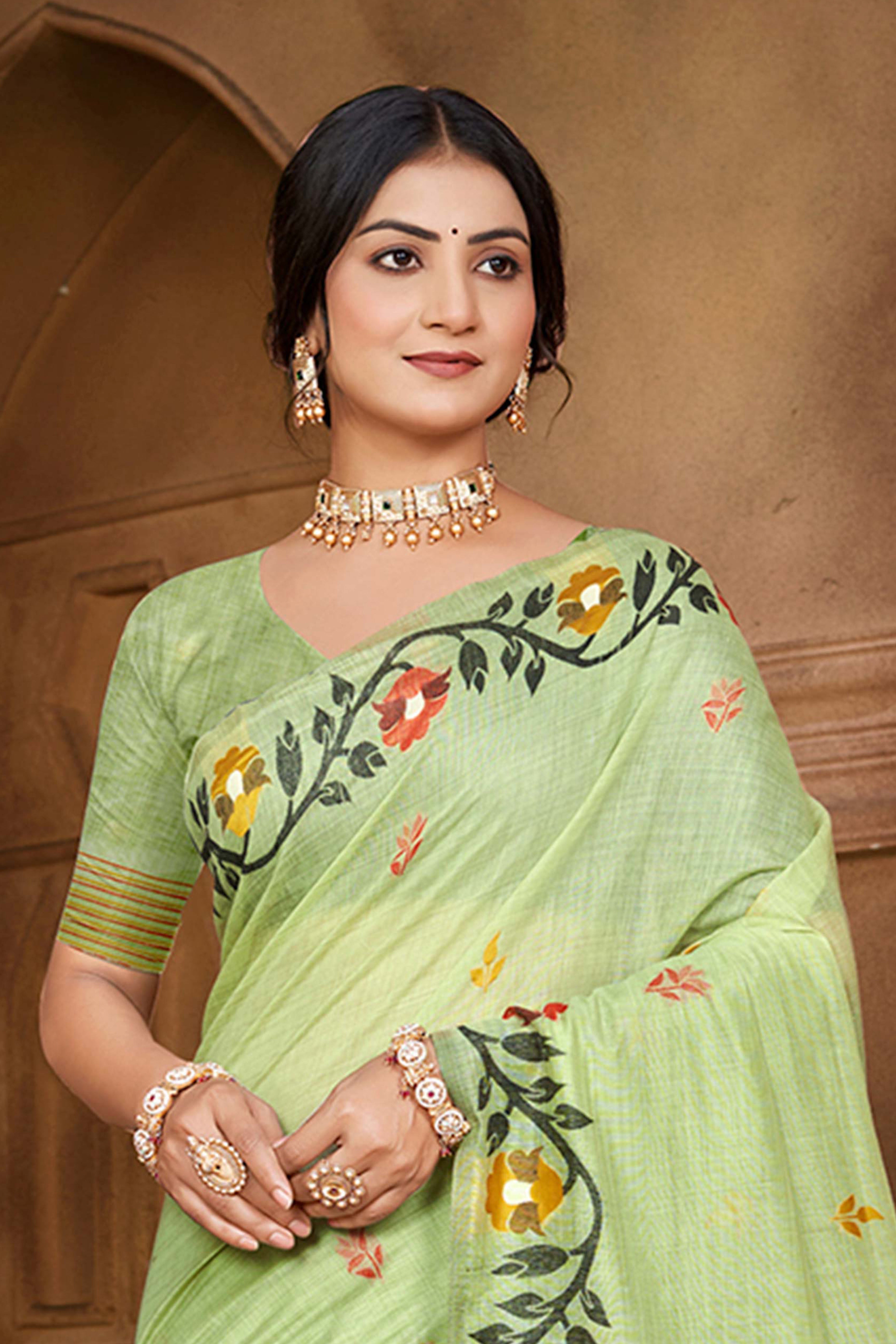 Charming Green Floral Weaving Cotton Silk Saree Enhanced With Tree Motif Pallu With Tassel