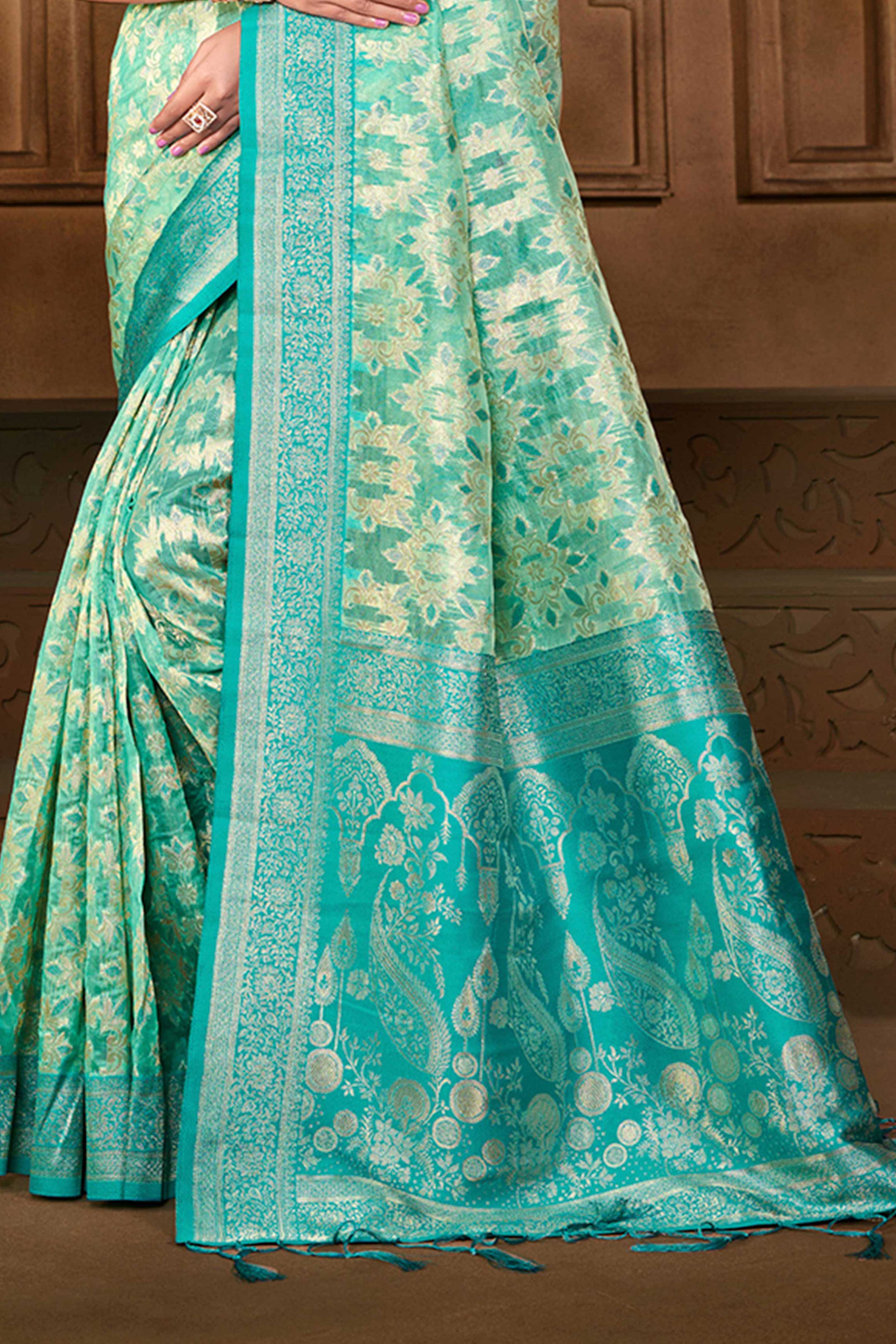 Stunning Turquoise Blue Floral Weaving Silk Blend Saree Enhanced With A Stylish Tassel Pallu