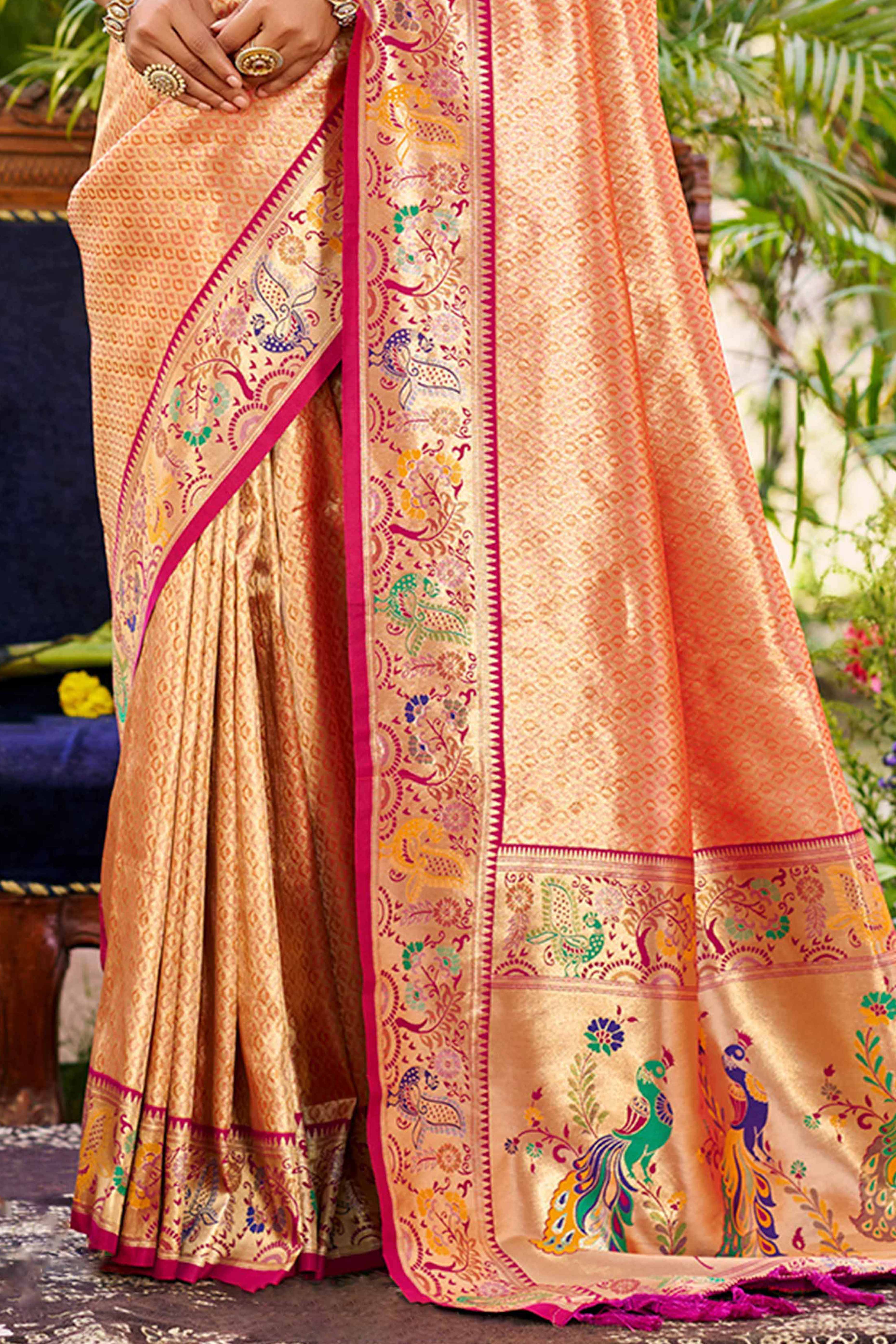 Graceful Orange Silk Blend Saree Adorned With Intricate Zari Weave & Peacock Motif Pallu