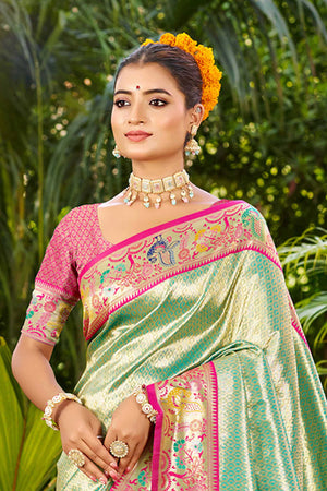 Graceful Turquoise Silk Blend Saree Adorned With Intricate Zari Weave & Peacock Motif Pallu