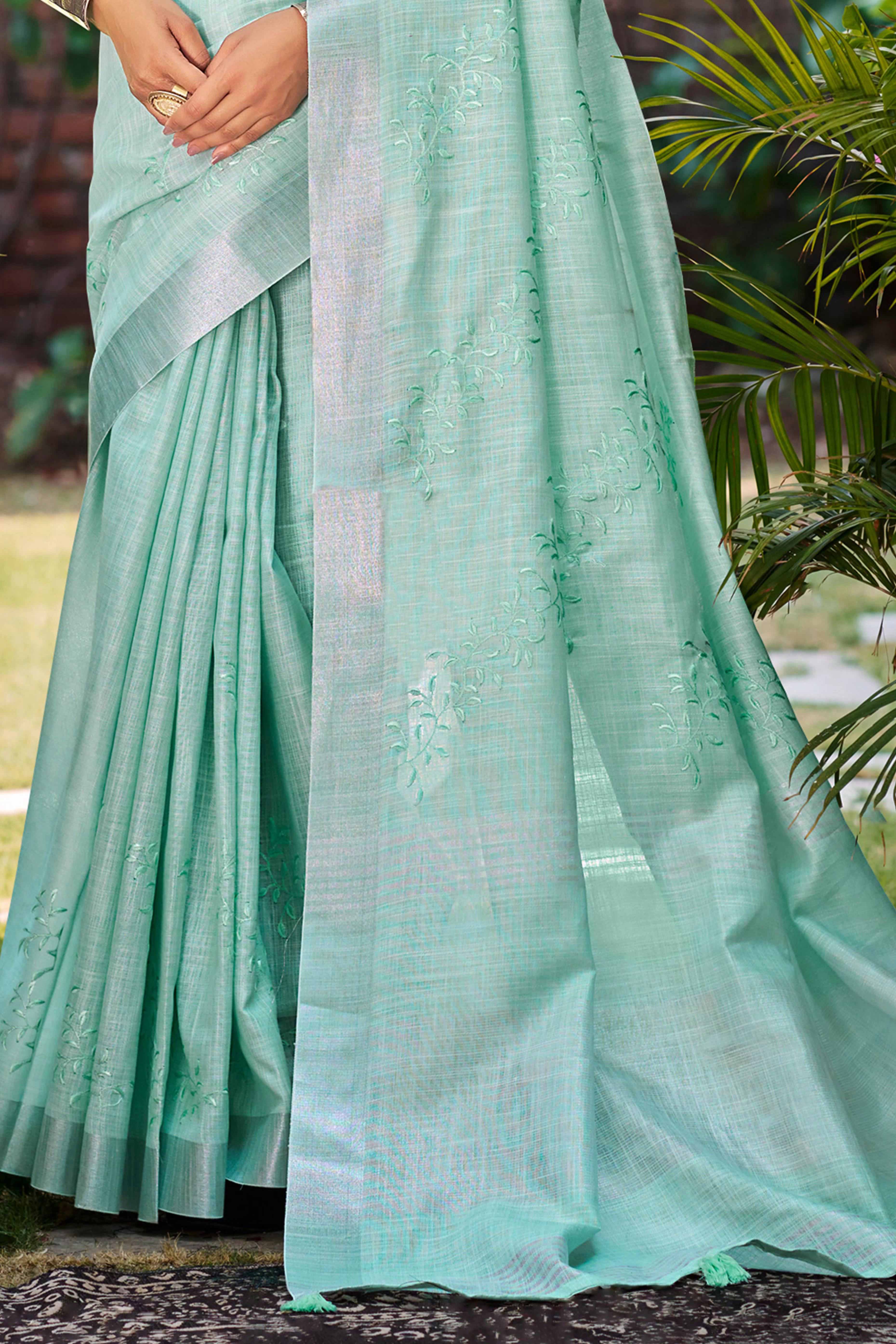 Elegant Sea Green Linen Saree Featuring Intricate Woven & Embroidered Patterns
