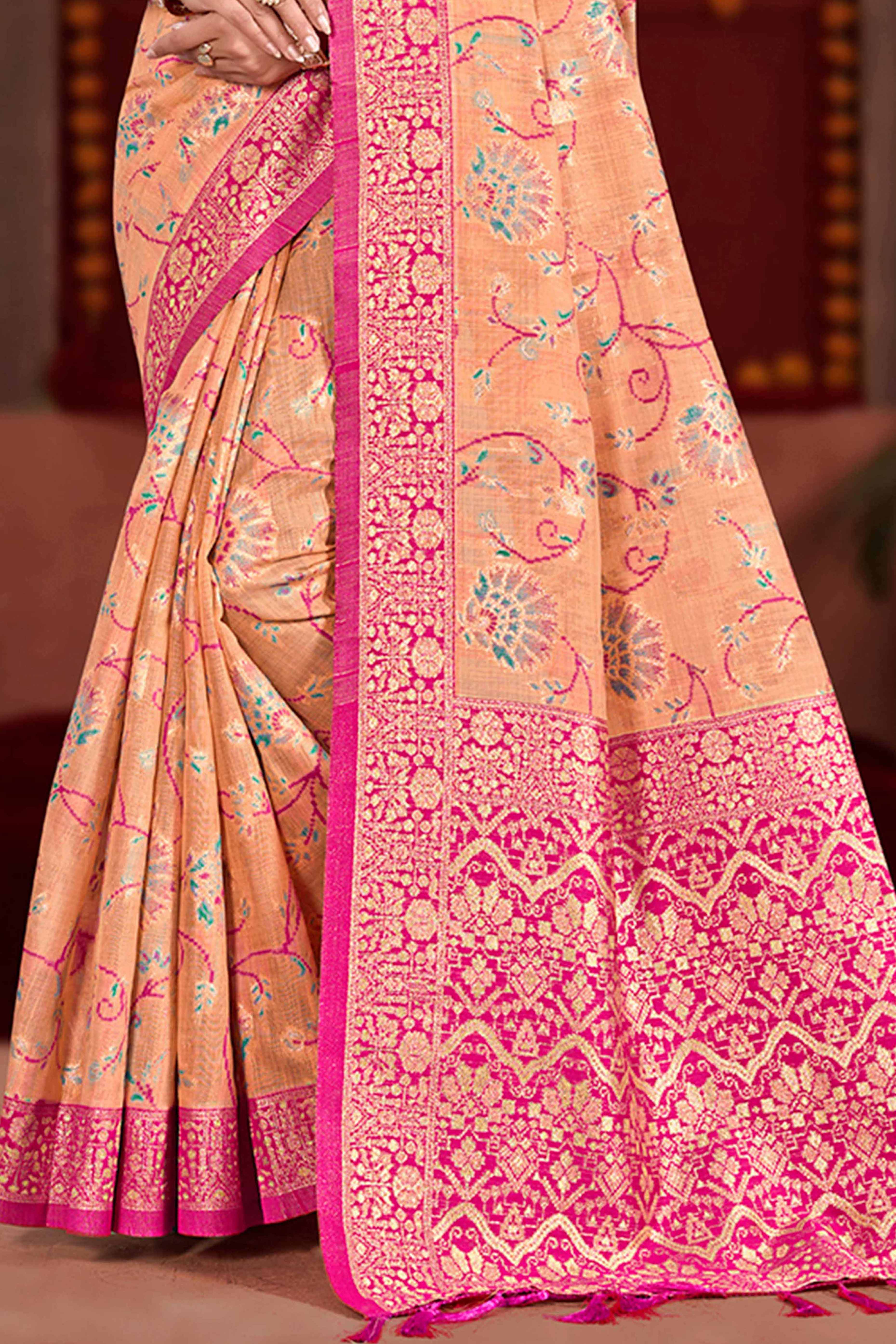 Elegant Light Orange Cotton Silk Saree Adorned With Floral Weaving & Graceful Tassel Pallu
