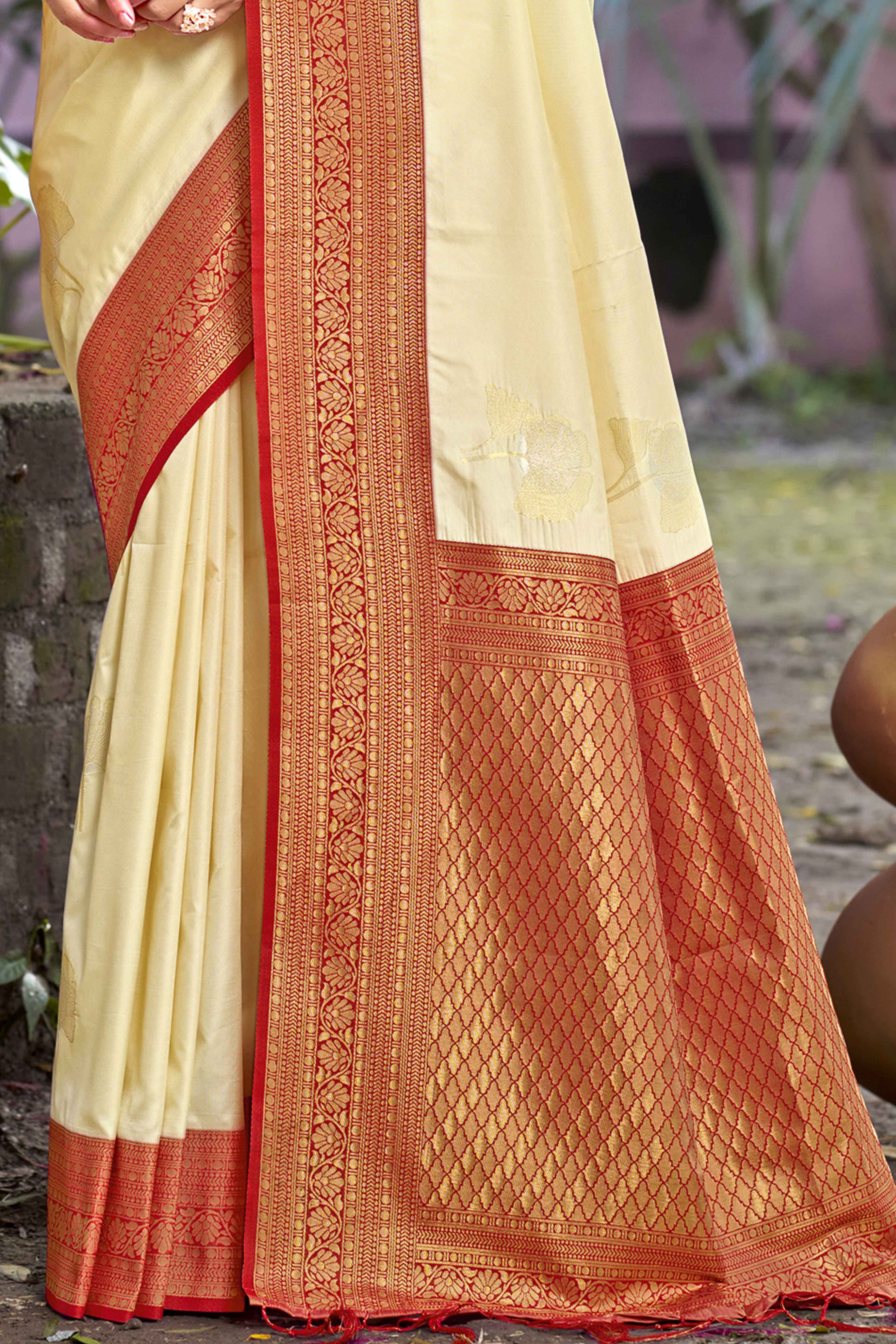 Cream Floral Woven Banarasi Silk Saree With Tassels