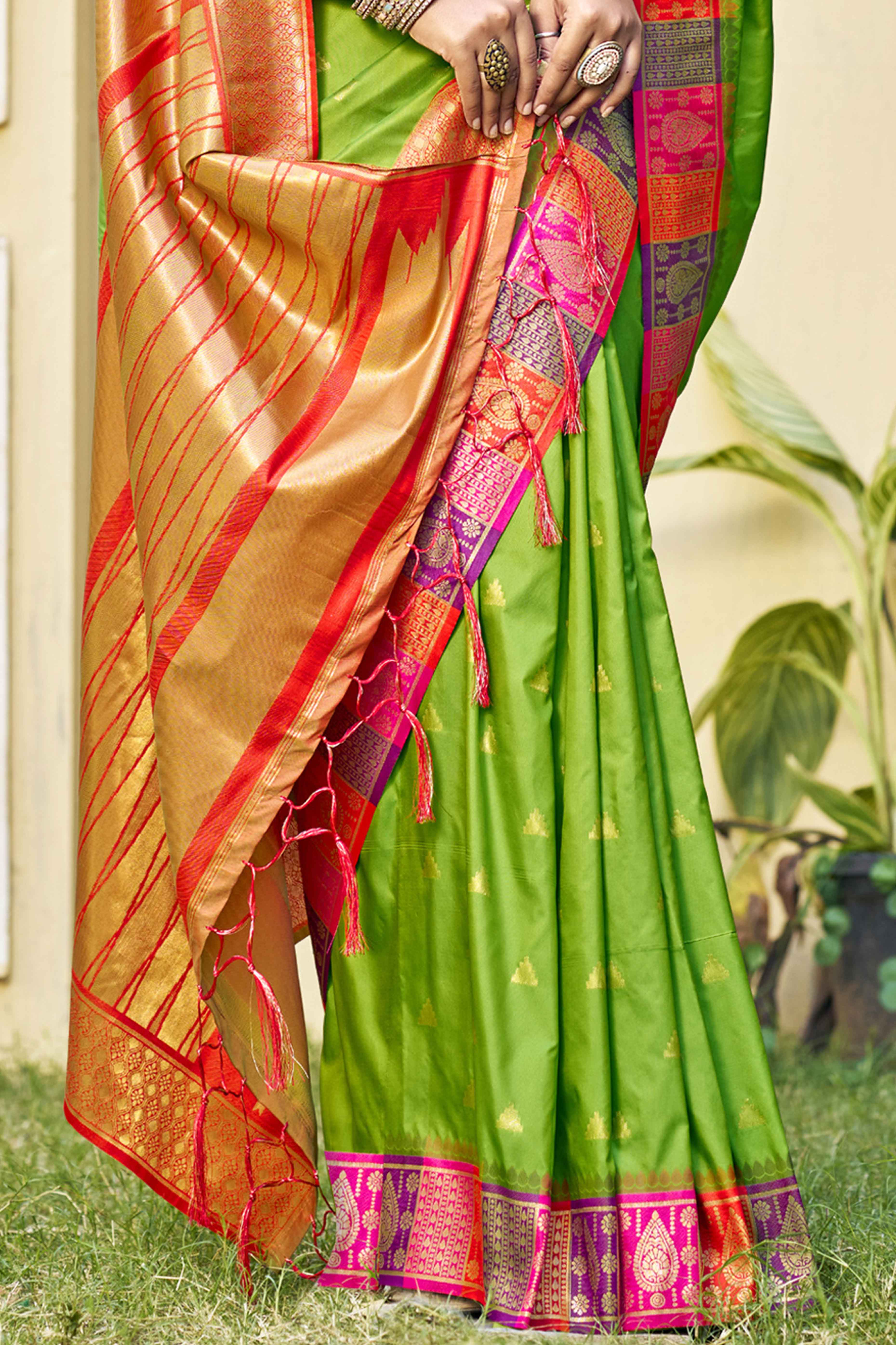 Green Woven Banarasi Silk Saree With Tassels