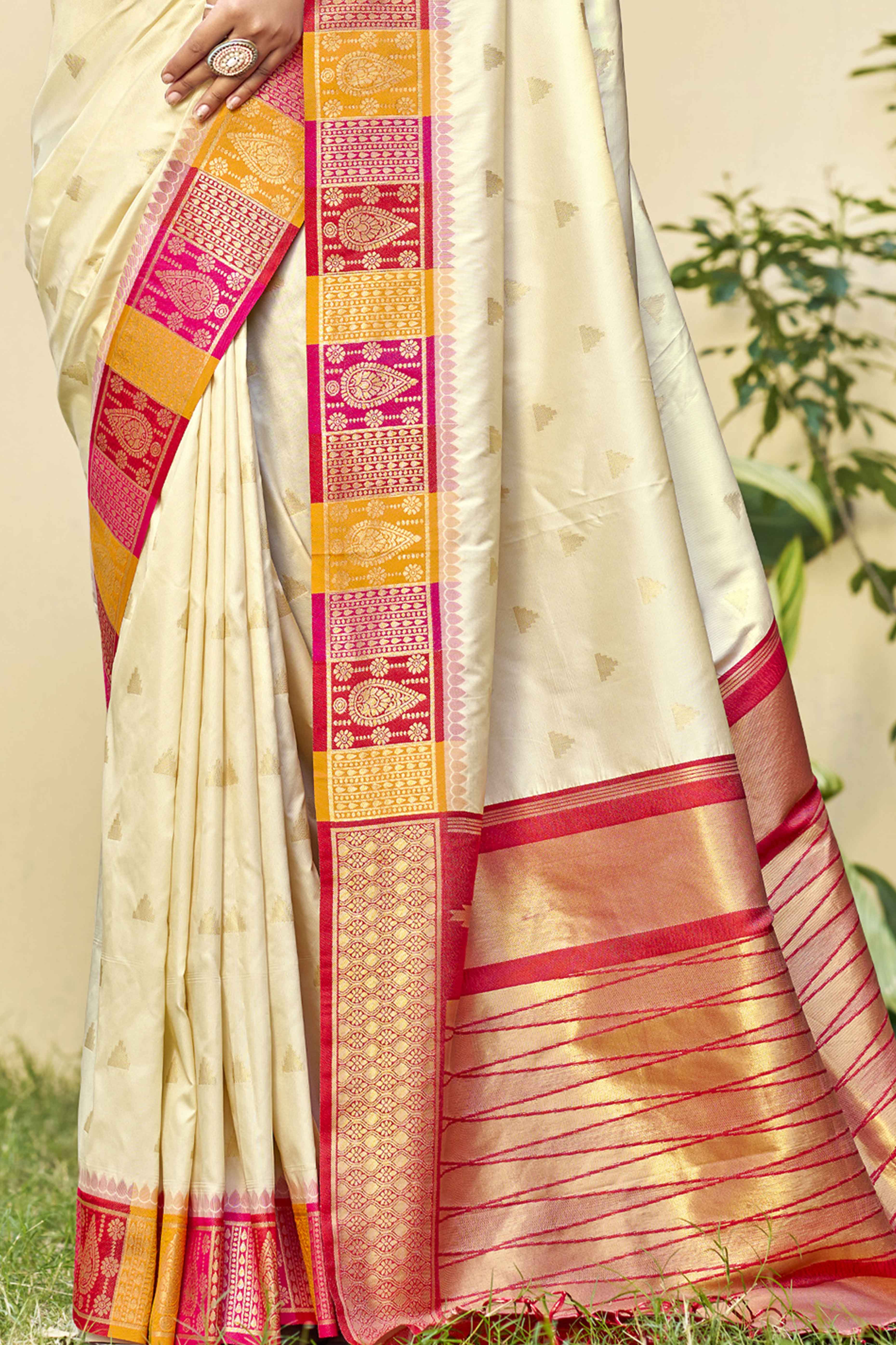 Cream Woven Banarasi Silk Saree With Tassels