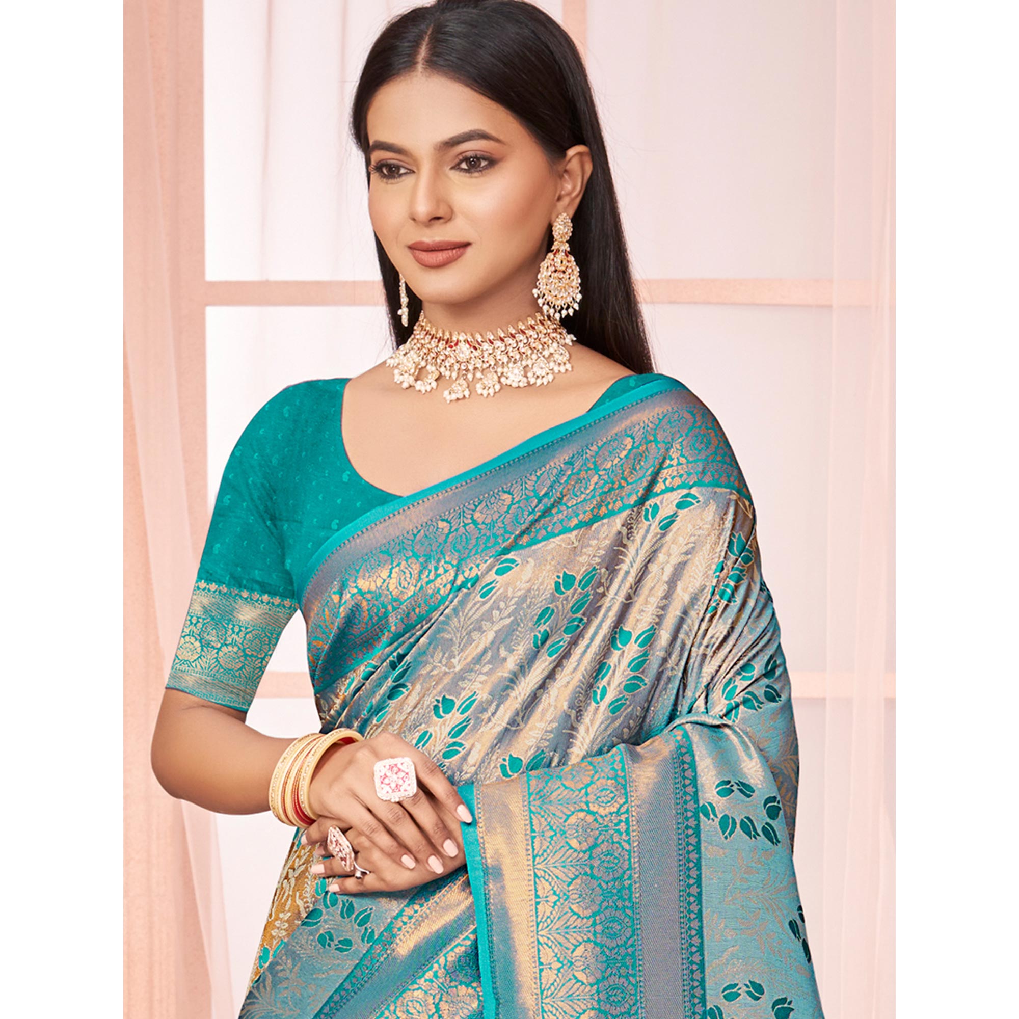 Turquoise Floral Woven Kanjivaram Silk Saree With Tassels
