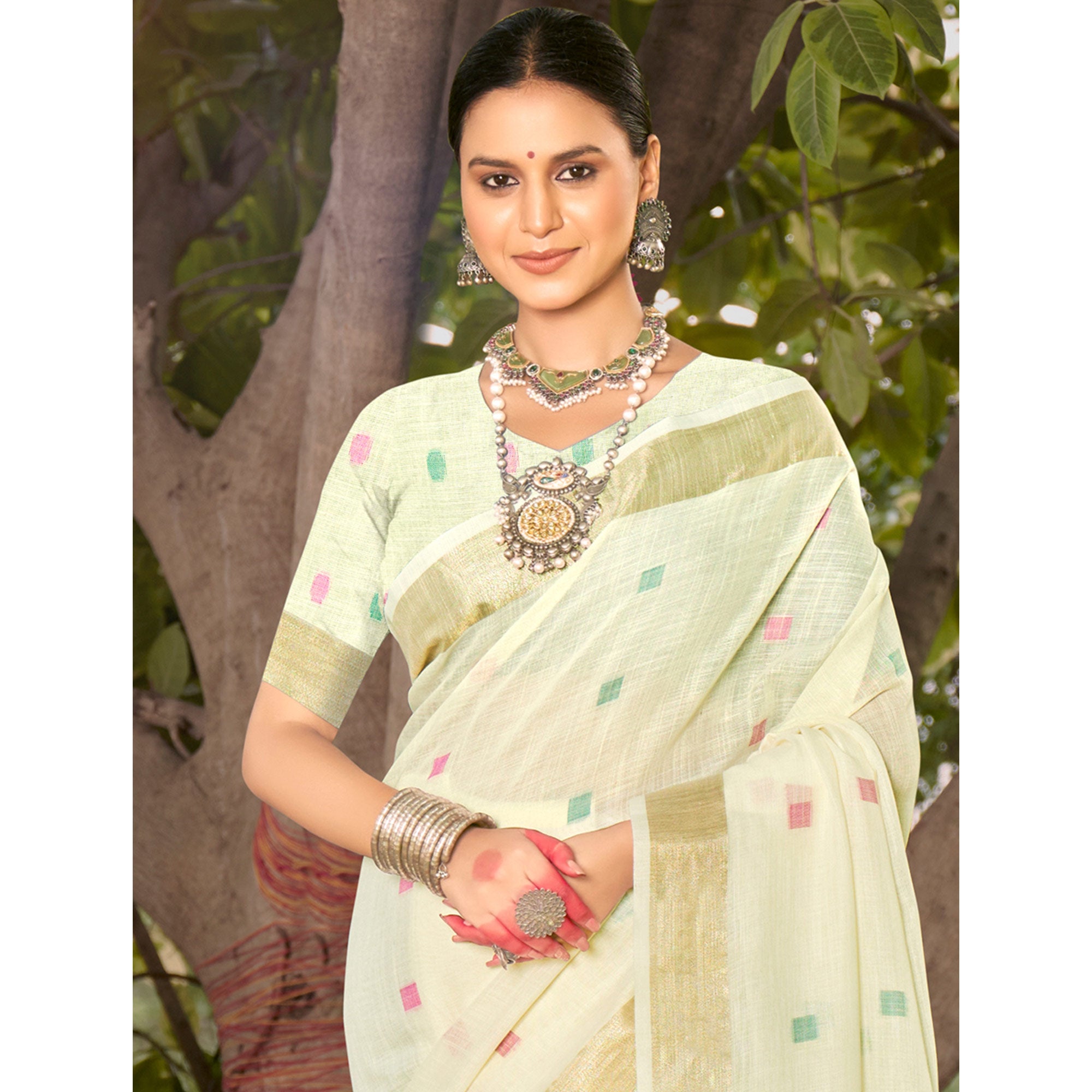 Cream Woven Cotton Blend Saree With Tassels