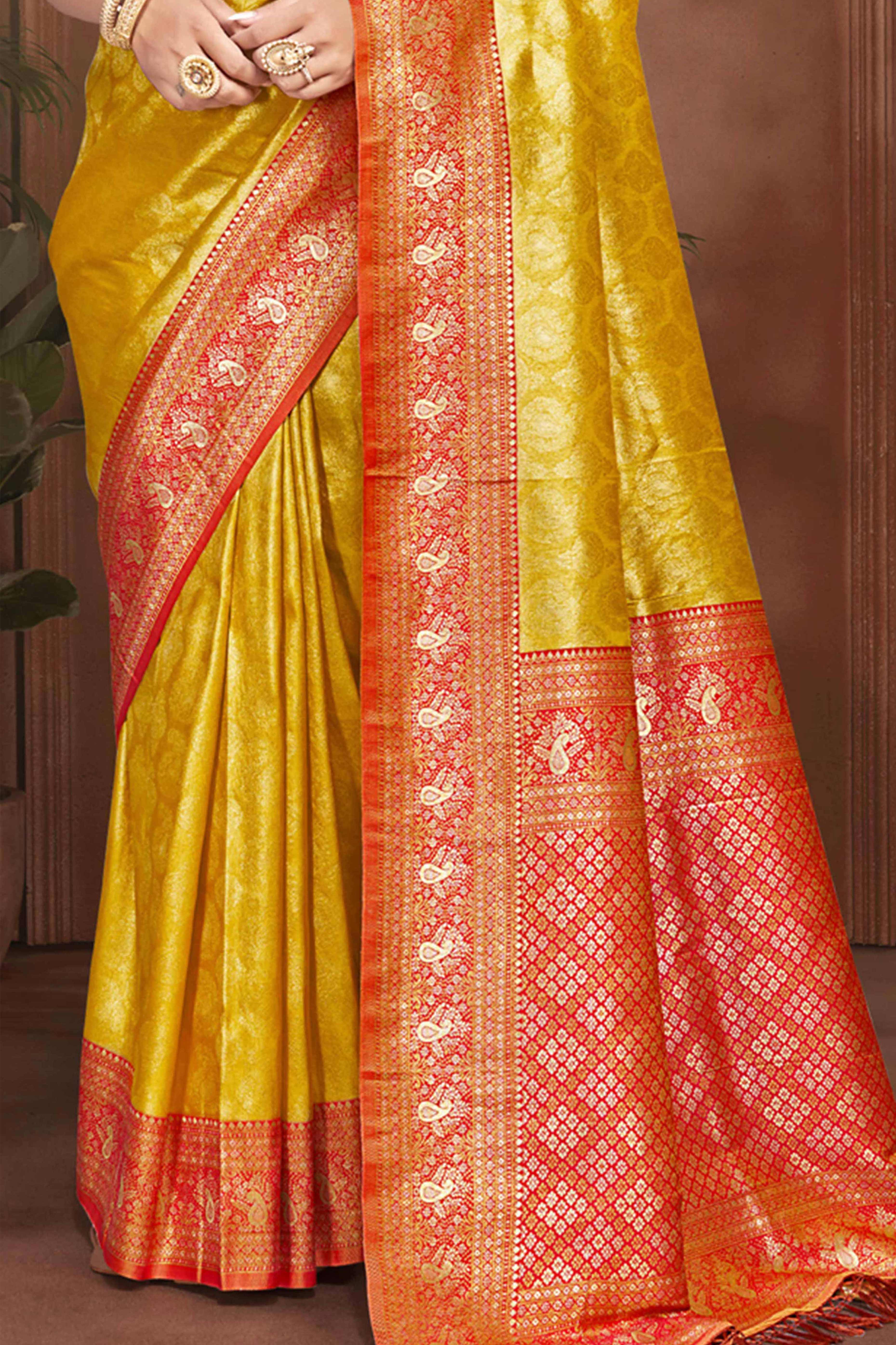 Exclusive Yellow Paisley & Floral Pattern Weaving Kanjivaram Silk Saree With Tassel Pallu