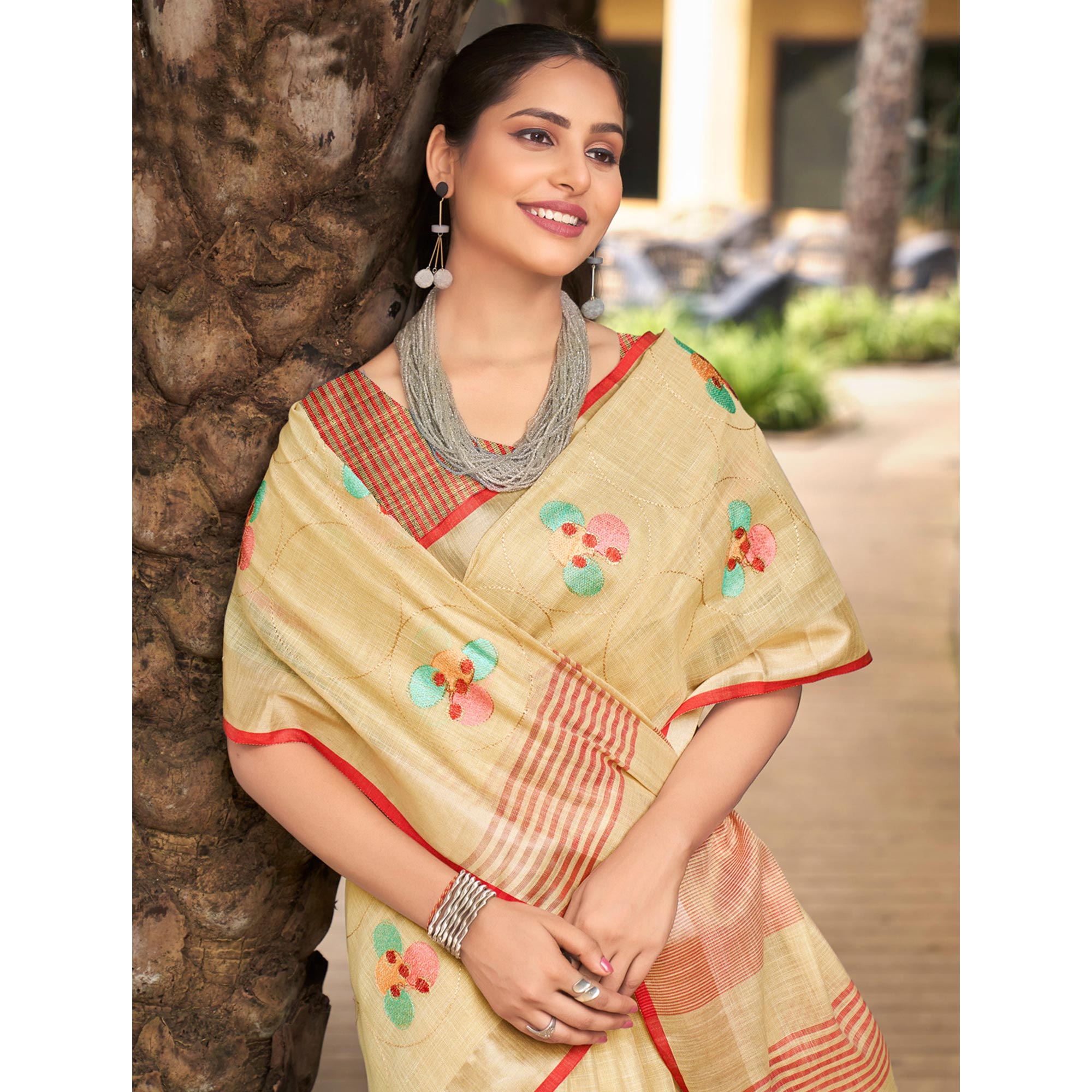 Beige Floral Embroidered Linen Saree With Tassels