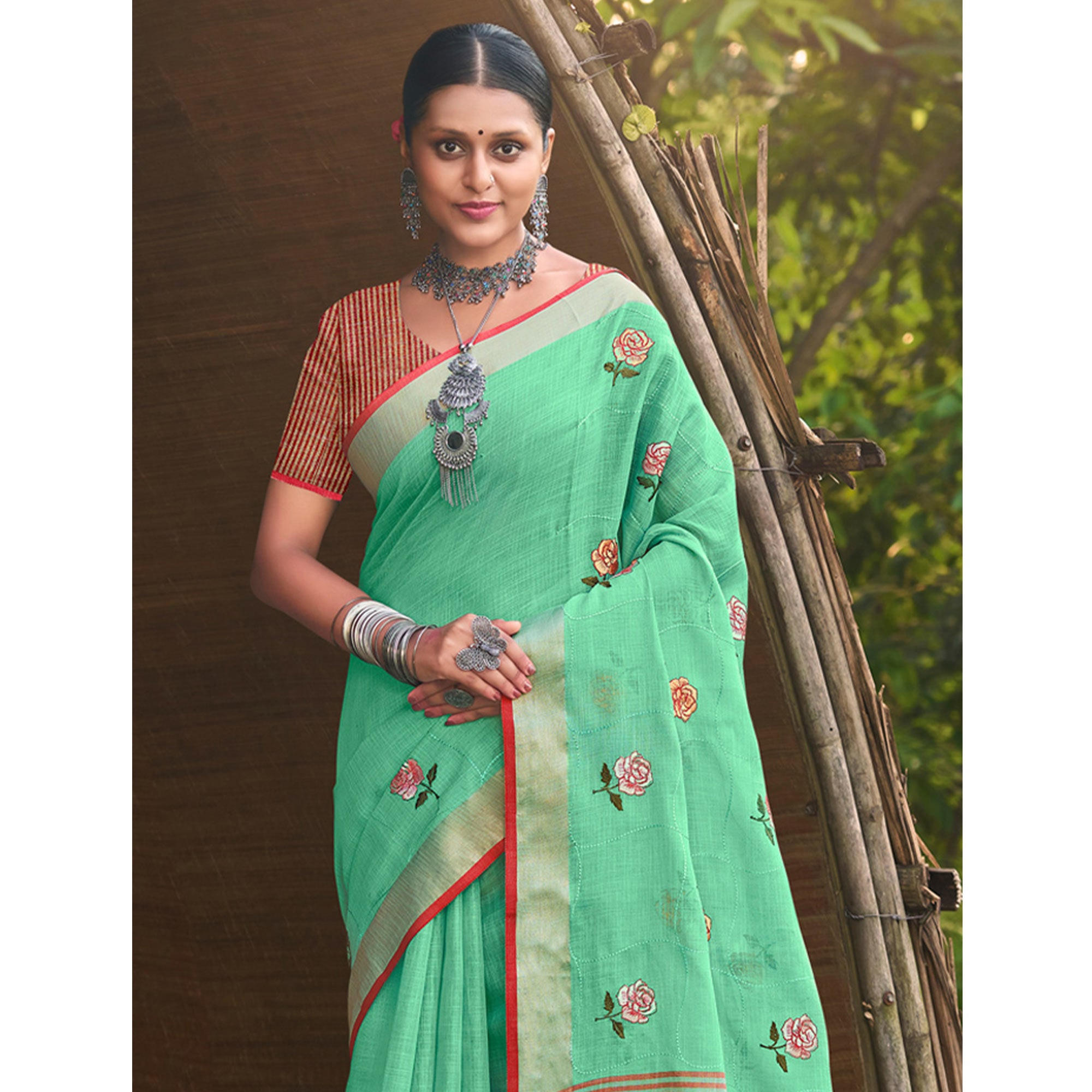 Sea Green Floral Embroidered Linen Saree With Tassels