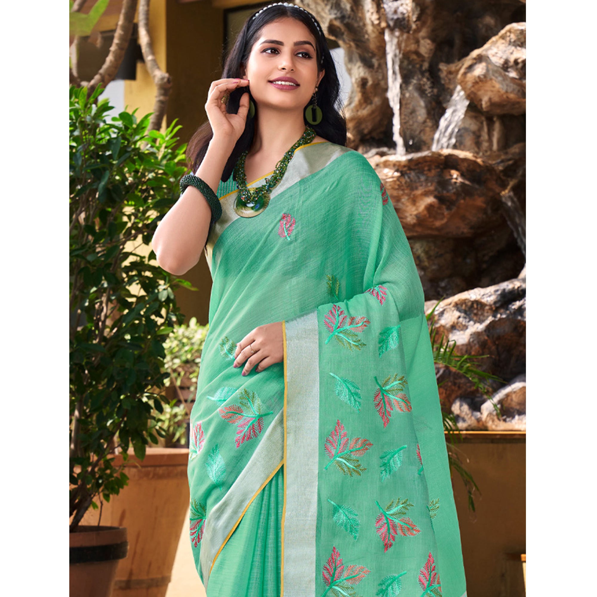 Sea Green Floral Embroidered Linen Saree With Tassels