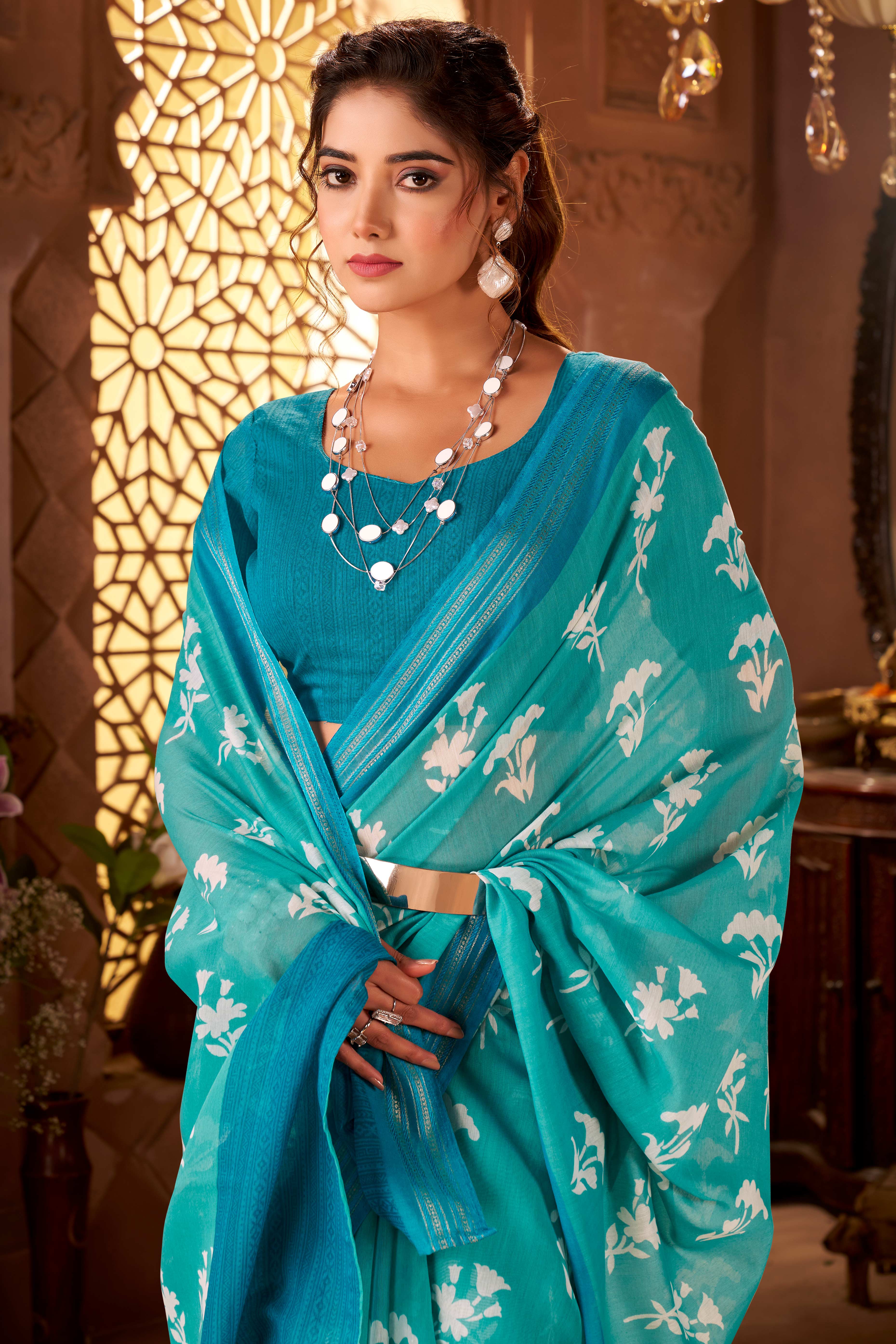 Sophisticated Turquoise Mulmul Cotton Saree Featuring Delicate Floral Prints & Weaving Border