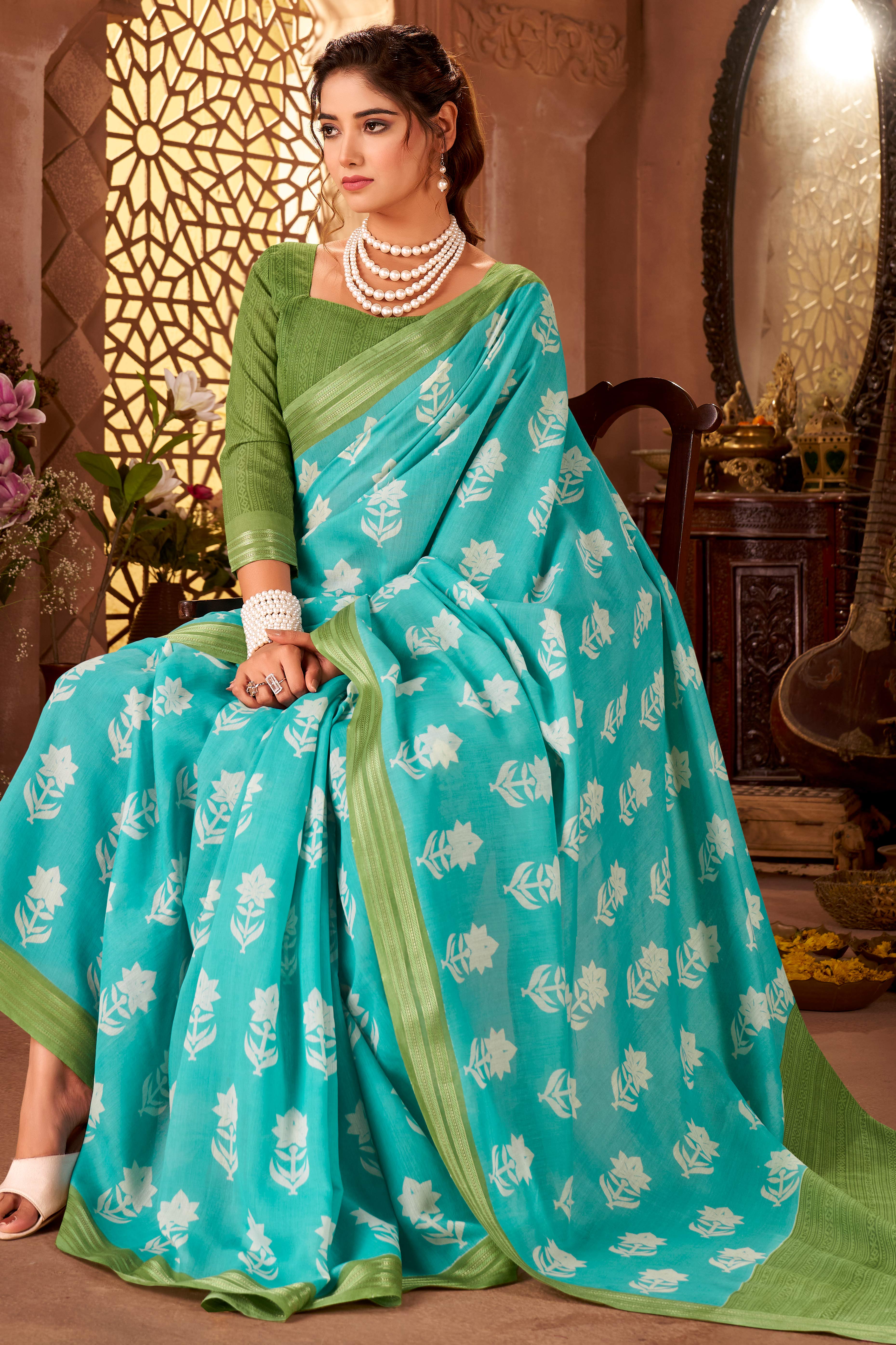 Sophisticated Blue Mulmul Cotton Saree Featuring Delicate Floral Prints & Weaving Border