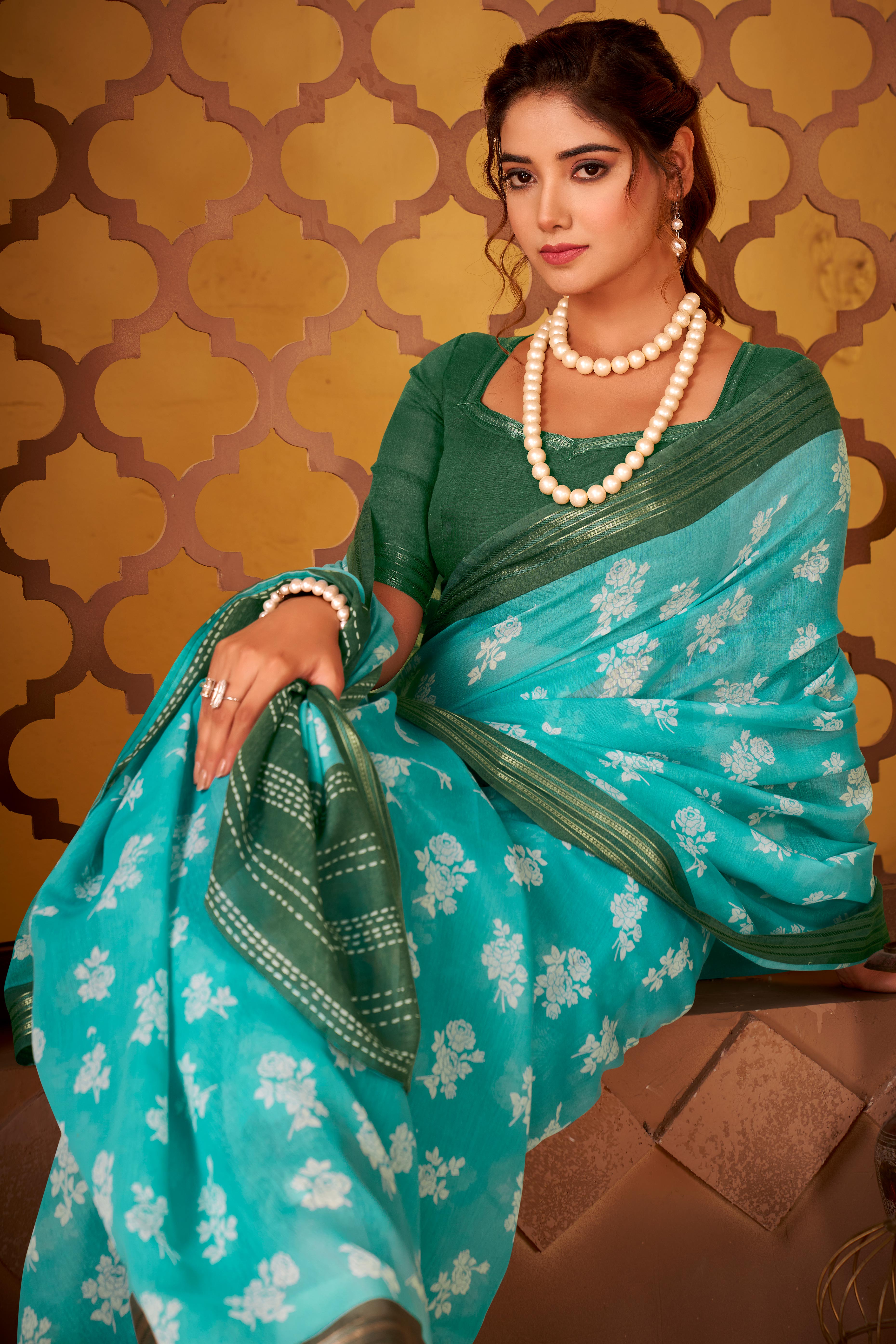 Sophisticated Turquoise Mulmul Cotton Saree Featuring Delicate Floral Prints & Weaving Border