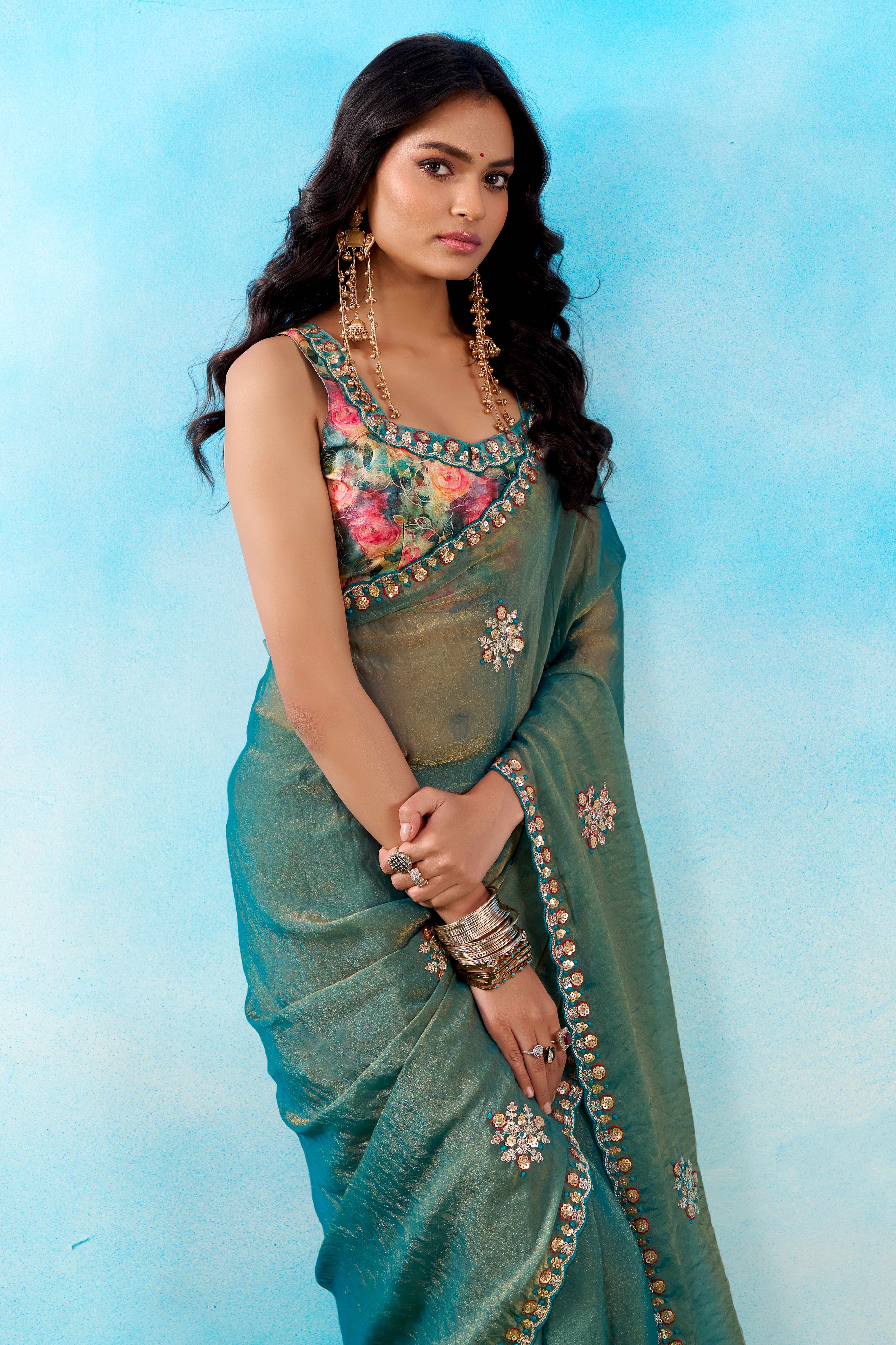 Luxurious Teal Chiffon Saree Showcasing Floral Sequins Embroidery In A Two Tone Finish