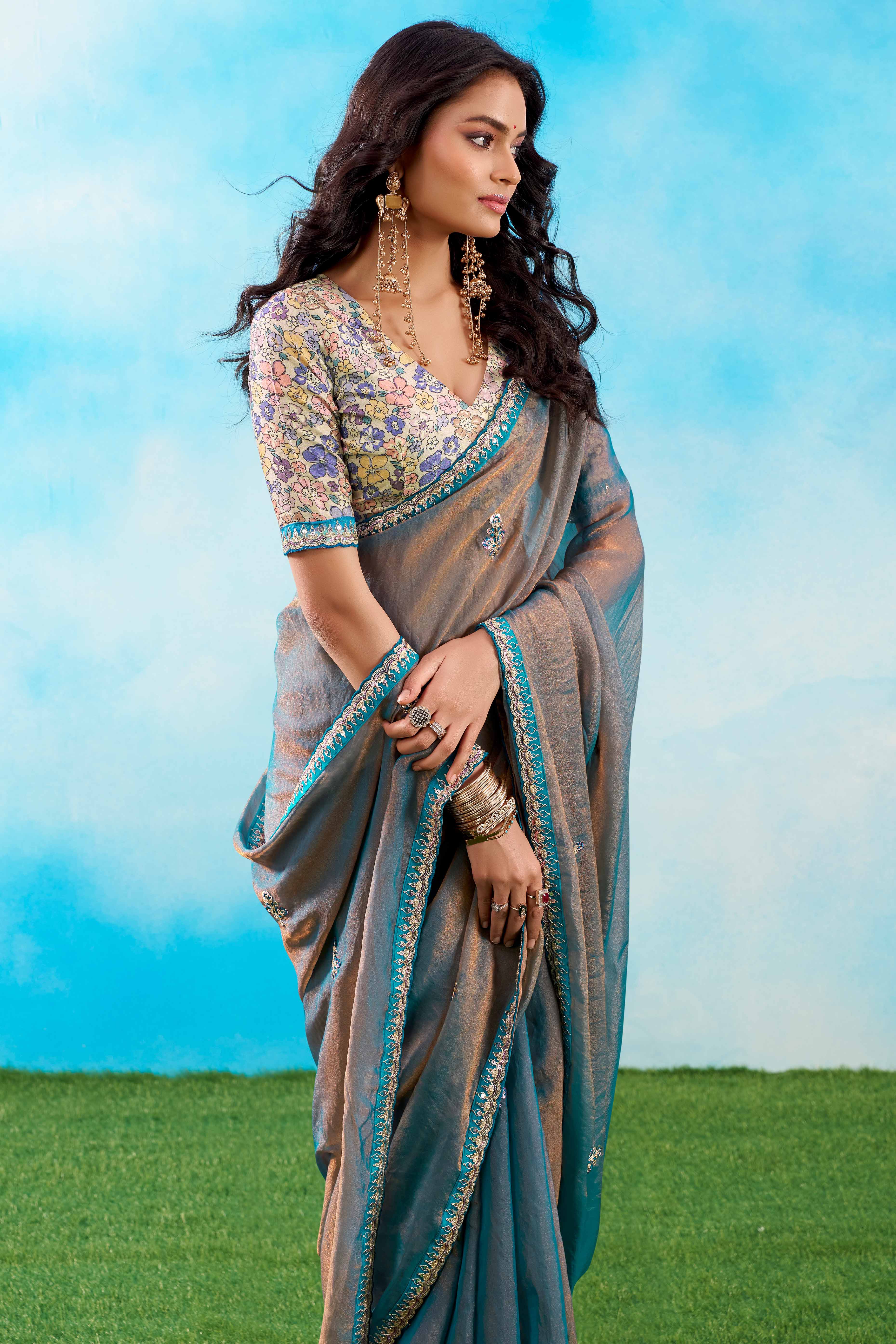 Luxurious Blue Chiffon Saree Showcasing Floral Sequins Embroidery In A Two Tone Finish