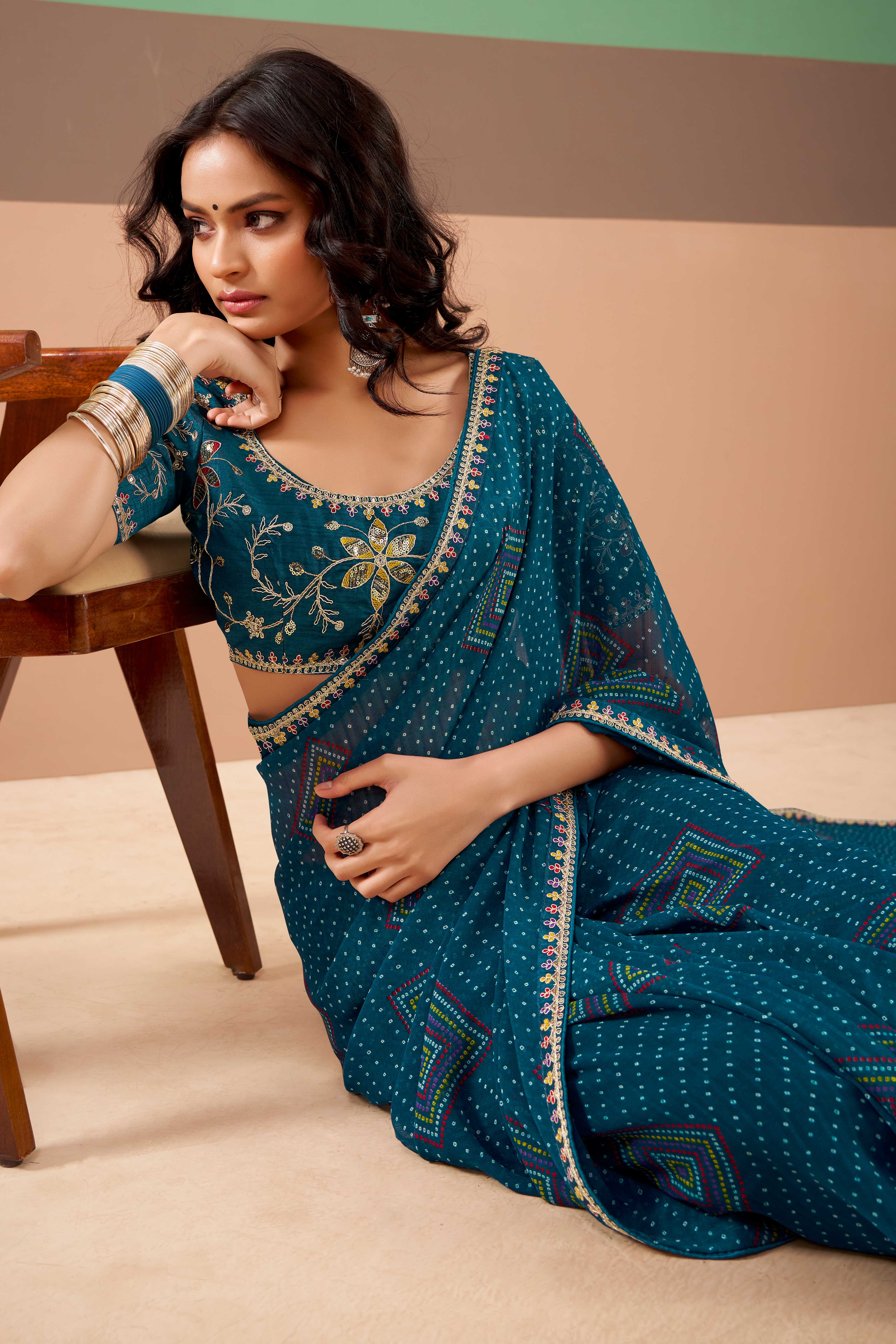 Charming Teal Bandhani Printed Georgette Saree Adorned With Intricate Cording Embroidered Border