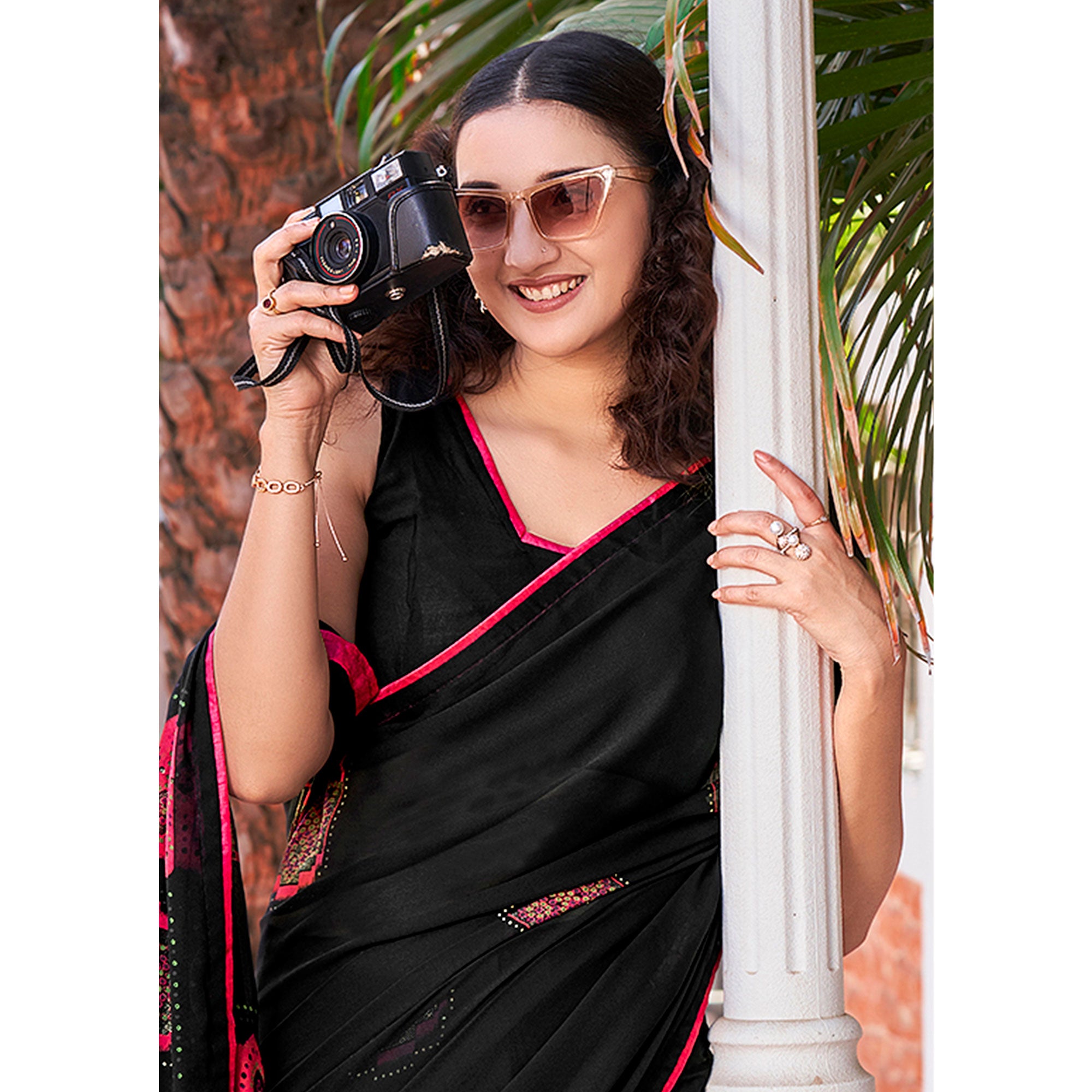 Black Foil Printed Georgette Saree With Tassels