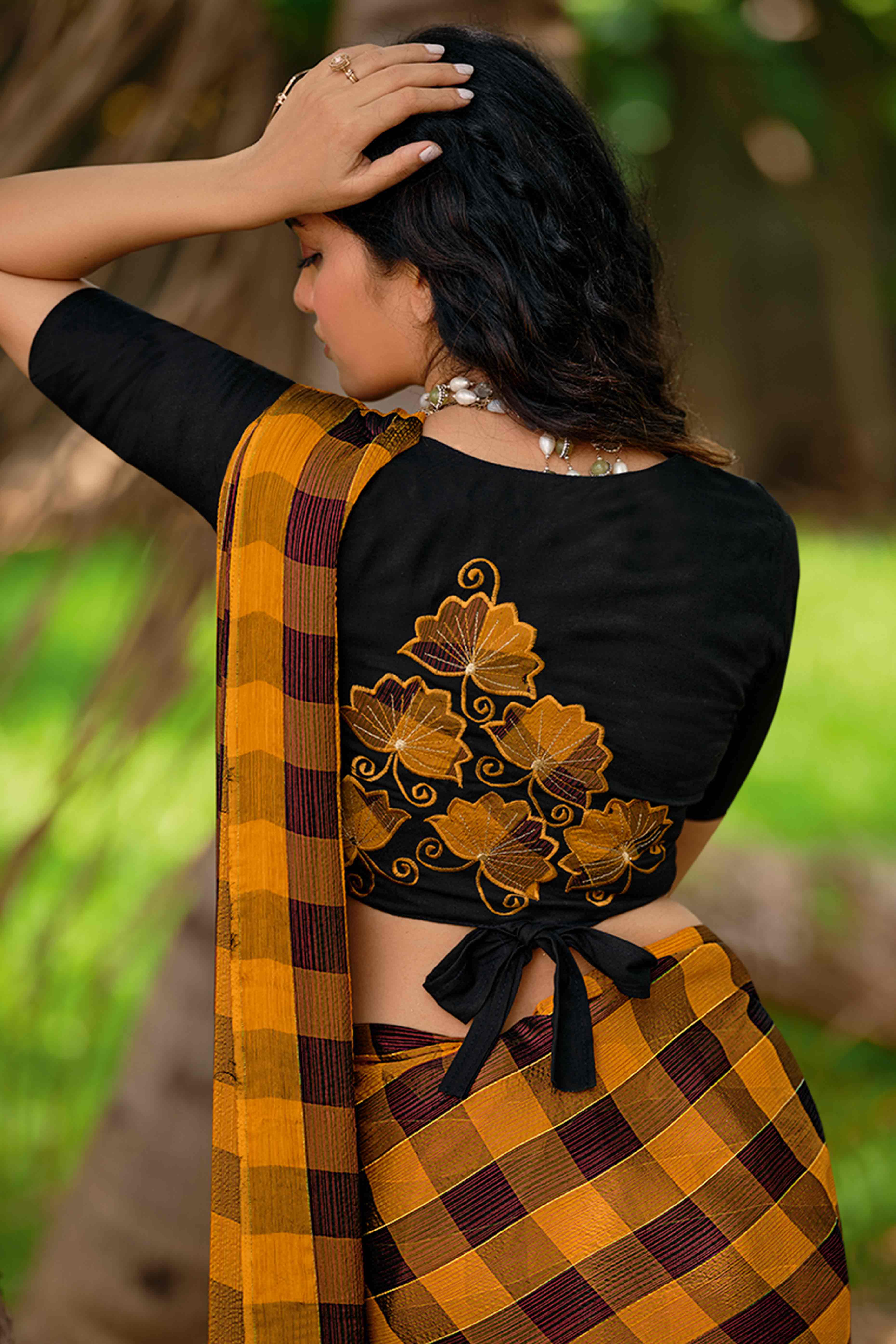 Ochre Orange With Intricate Black Weaving Checks Georgette Saree