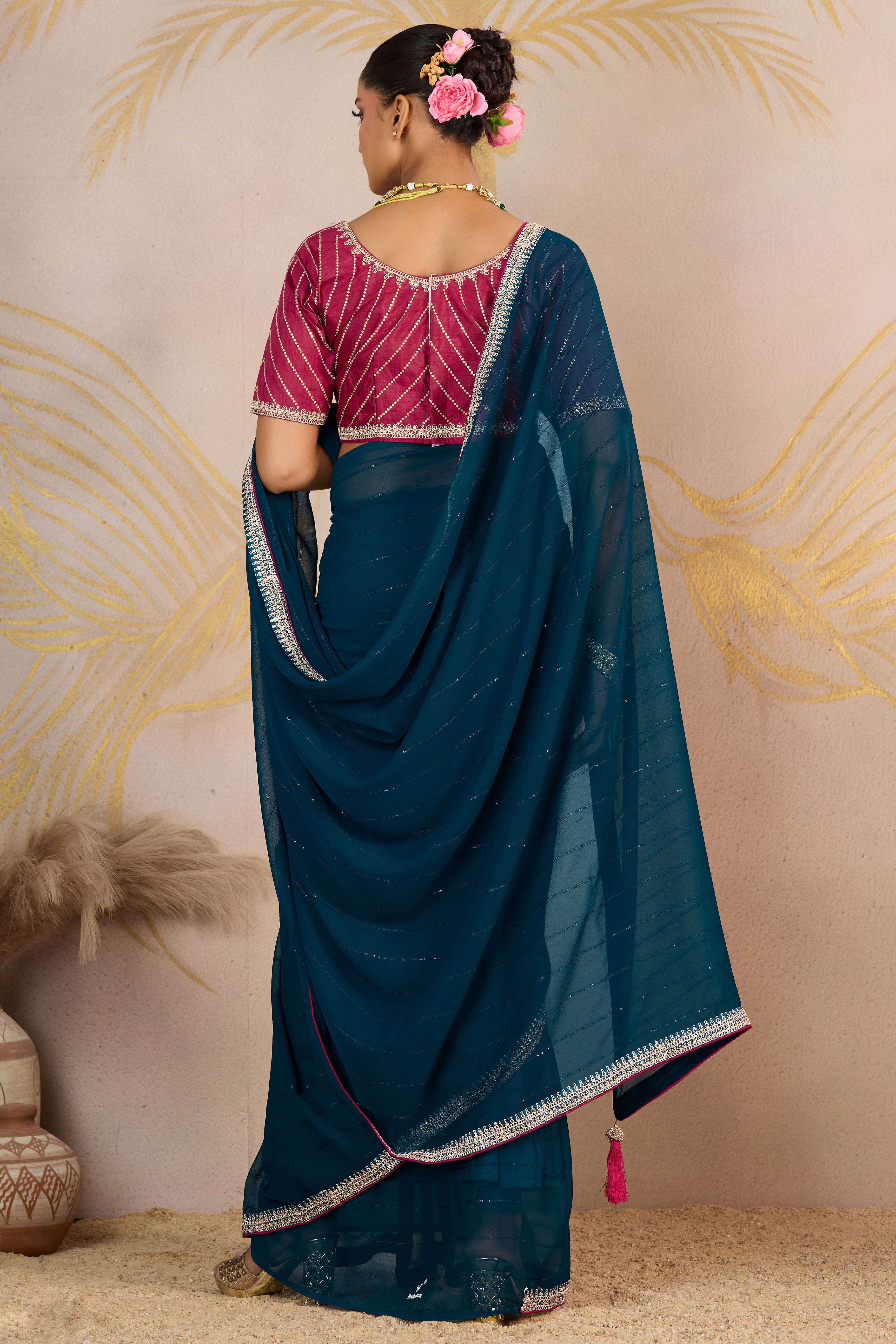 Teal Zari Embroidered Georgette Saree Accented With Sequins