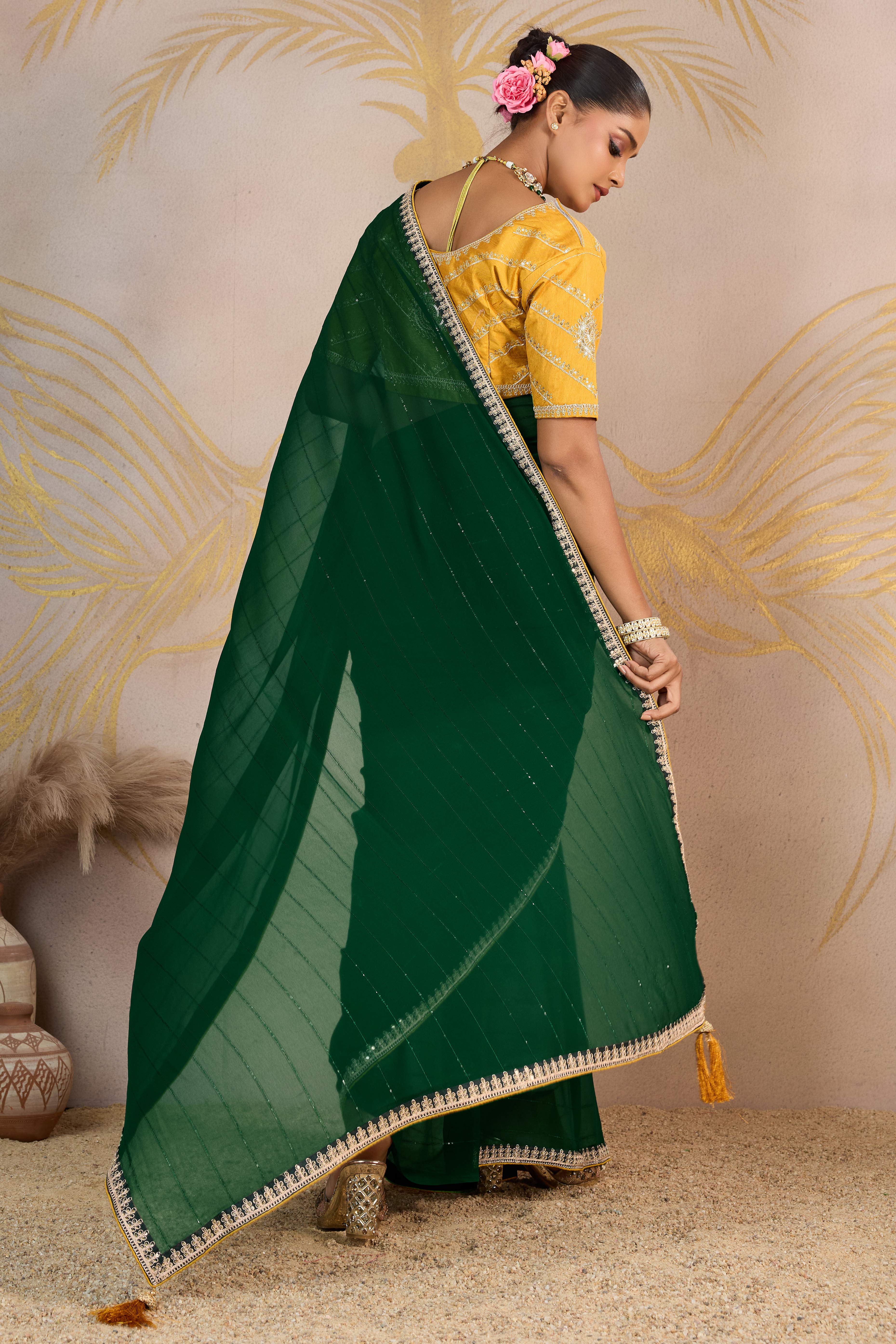 Green Zari Embroidered Georgette Saree Accented With Sequins