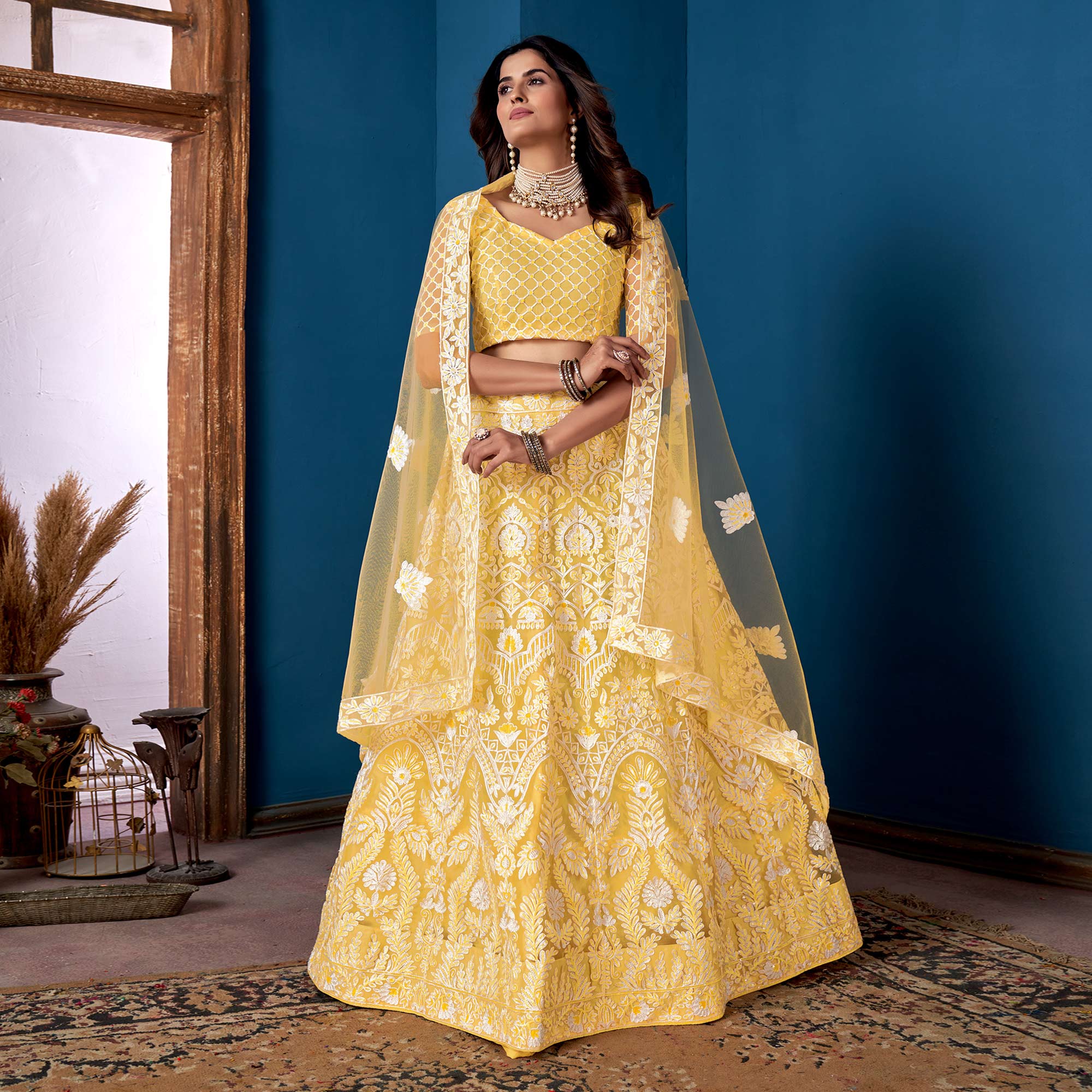 Yellow Floral Sequins Embroidered Net Lehenga Choli