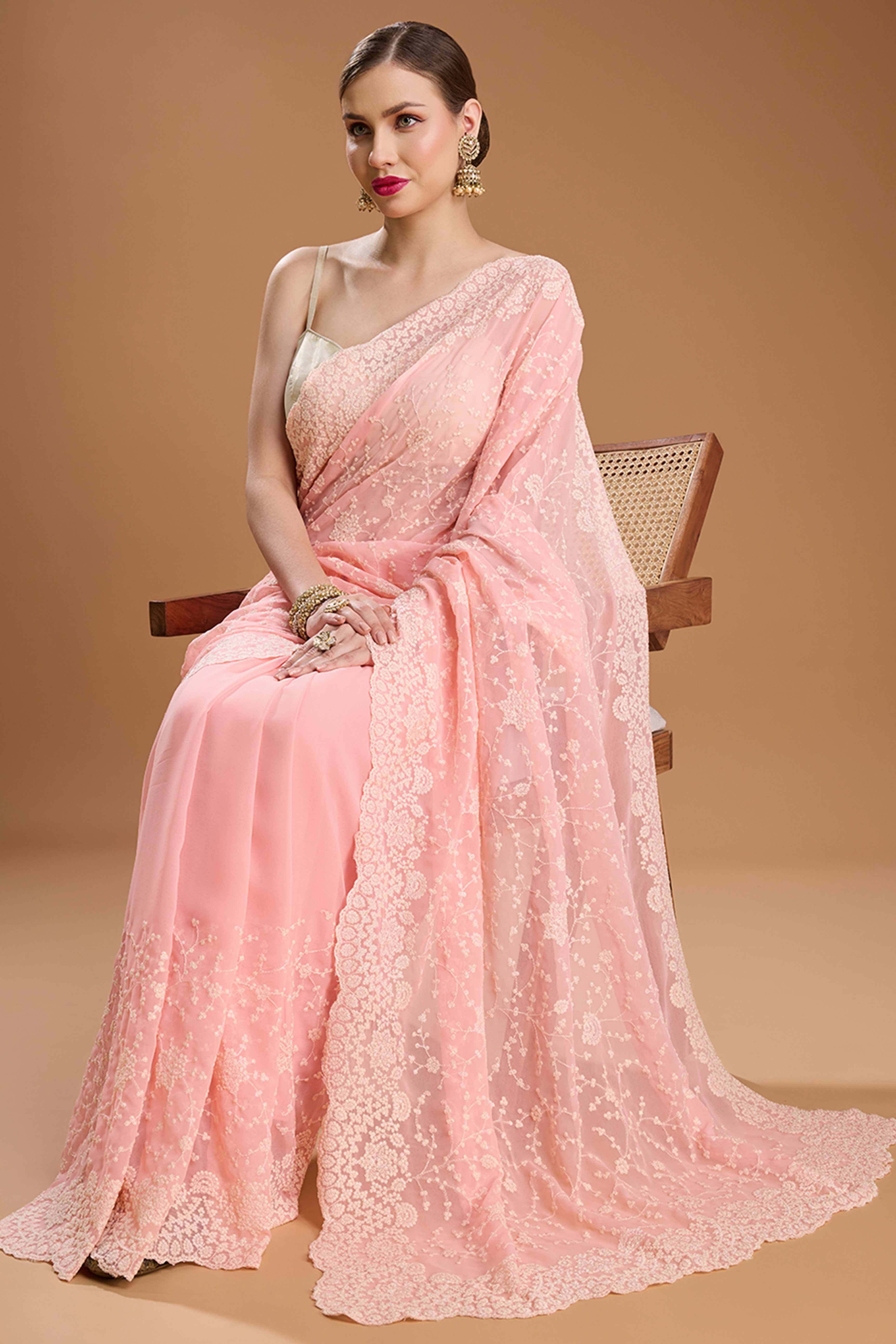 Soft Pastel Pink Embroidered Georgette Saree Featuring Thread Detailing